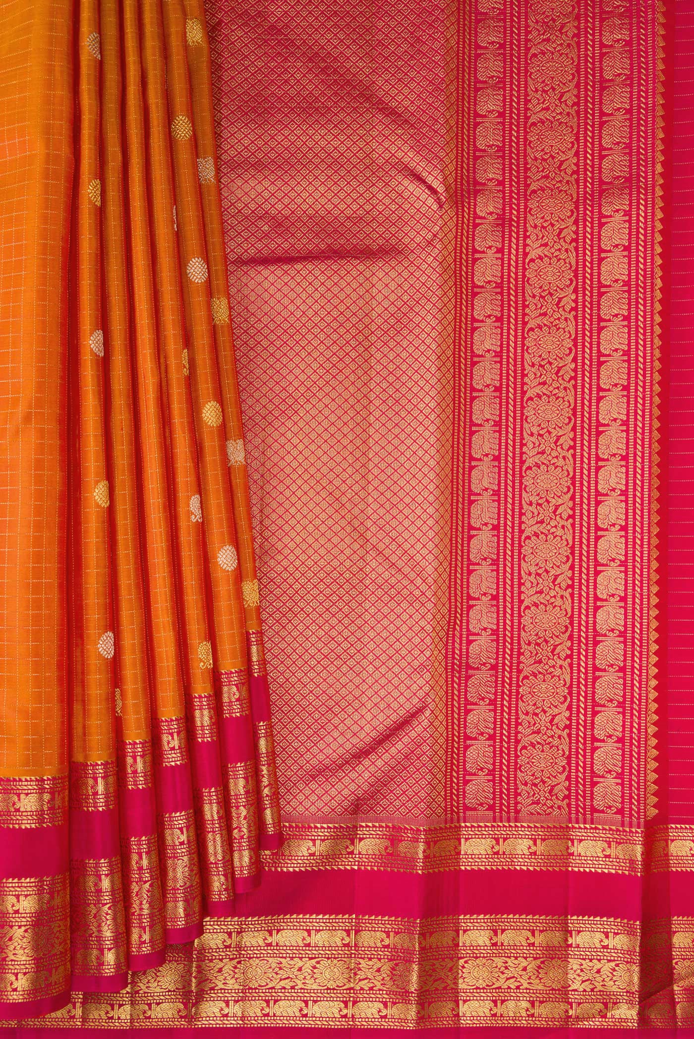 Pleats and pallu of Pure Silk Mustard Kanchipuram Saree with Checked design on the body and Zari Border. 
