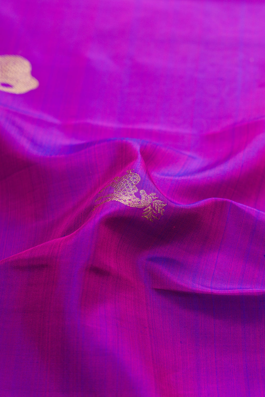 Close up of Pure Silk Purple Kanchipuram Saree with Zari Butta on the body and Zari Border.  displaying folds