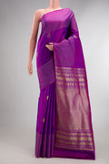 Pure Silk Purple Kanchipuram Saree with Zari Butta on the body and Zari Border.  displayed on a mannequin