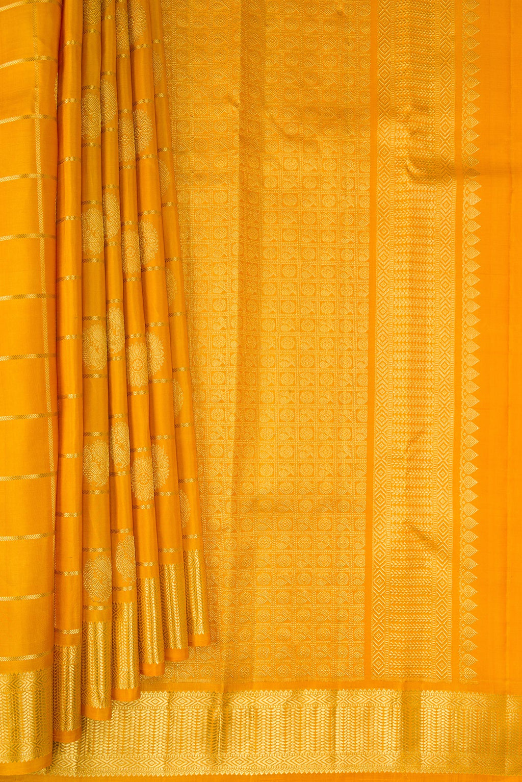 Pleats and pallu of Pure Silk Mustard Kanchipuram Saree with Checked design on the body and Zari Border. 