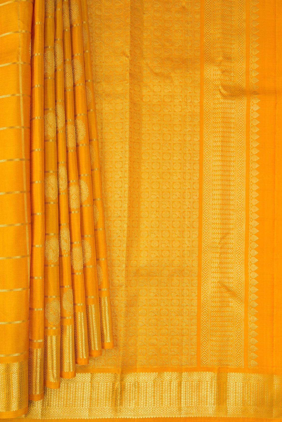 Pleats and pallu of Pure Silk Mustard Kanchipuram Saree with Checked design on the body and Zari Border. 