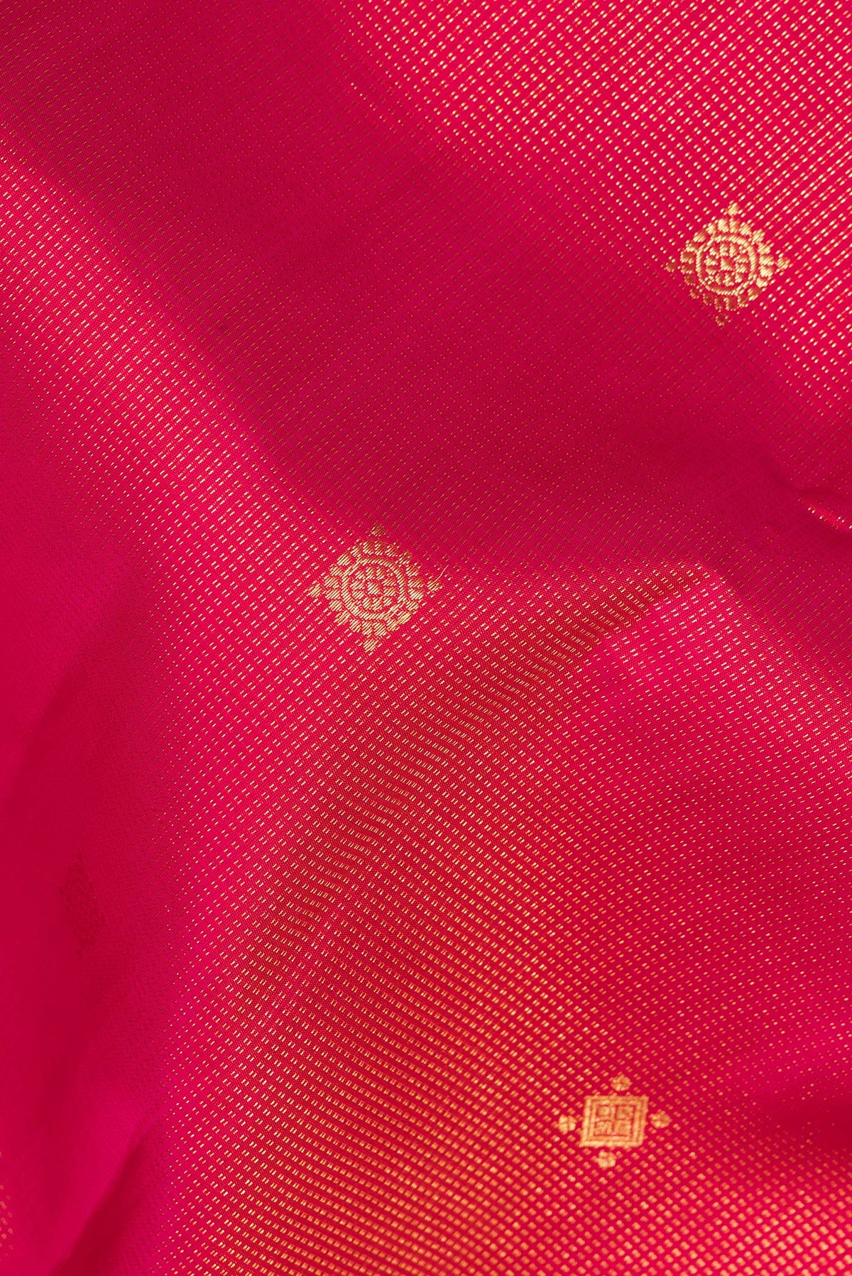 Close up of Pure Silk Pink Dual Tone Kanchipuram Saree with Stripes on the body and Zari Border.  displaying folds