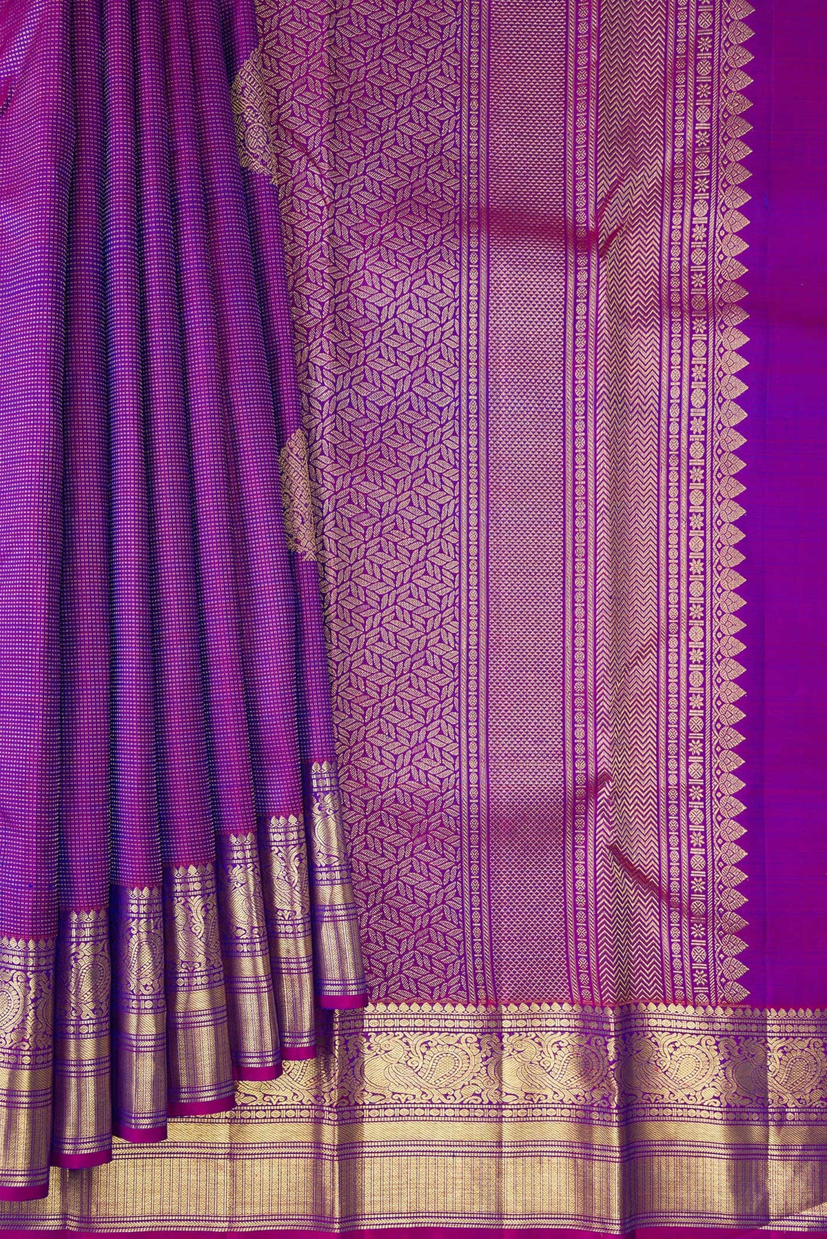 Pleats and pallu of Pure Silk Purple Kanchipuram Saree with Zari Butta on the body and Zari Border. 