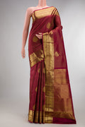 Pure Silk Maroon Kanchipuram Saree with Checked design on the body and Zari Border.  displayed on a mannequin