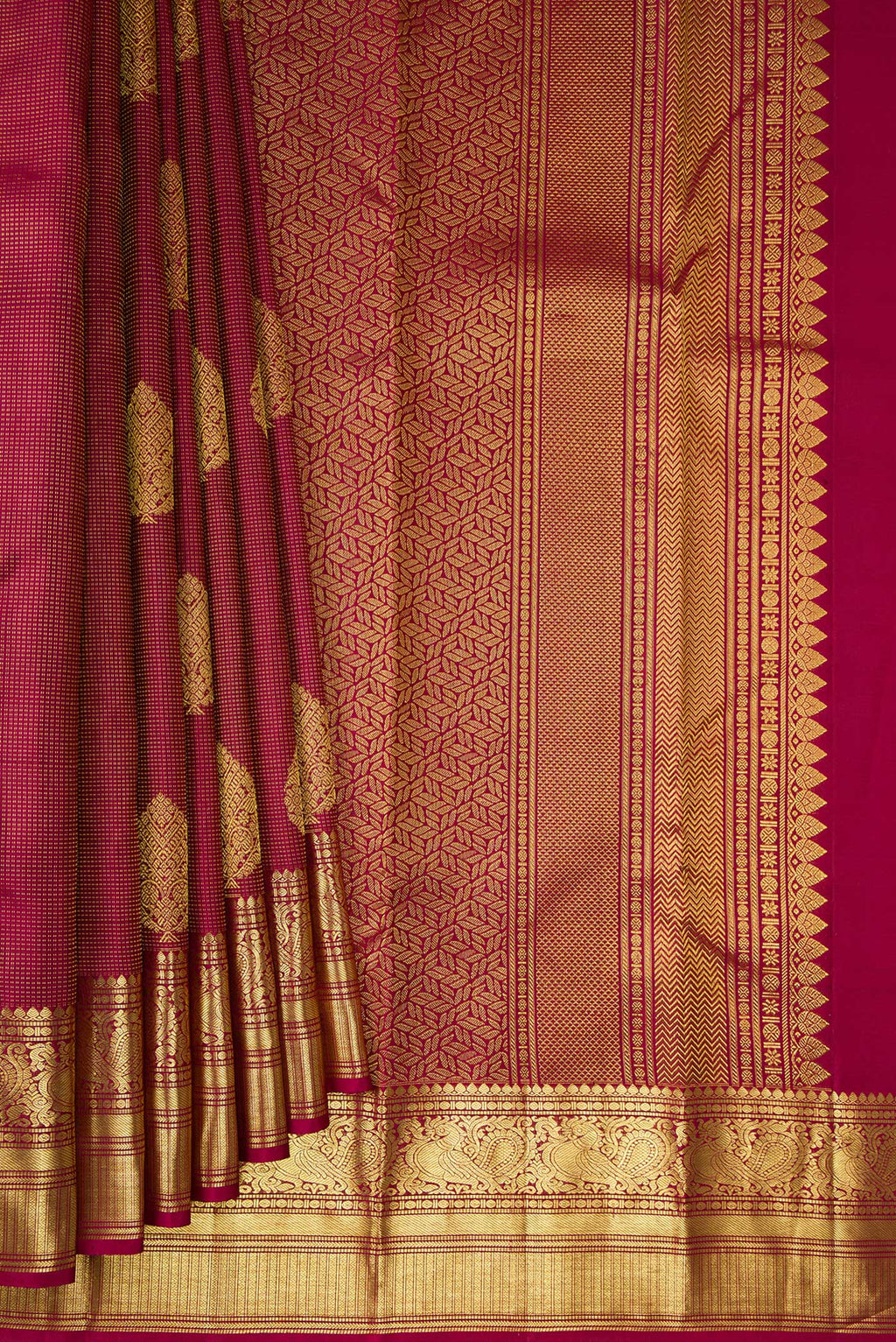 Pleats and pallu of Pure Silk Maroon Kanchipuram Saree with Checked design on the body and Zari Border. 