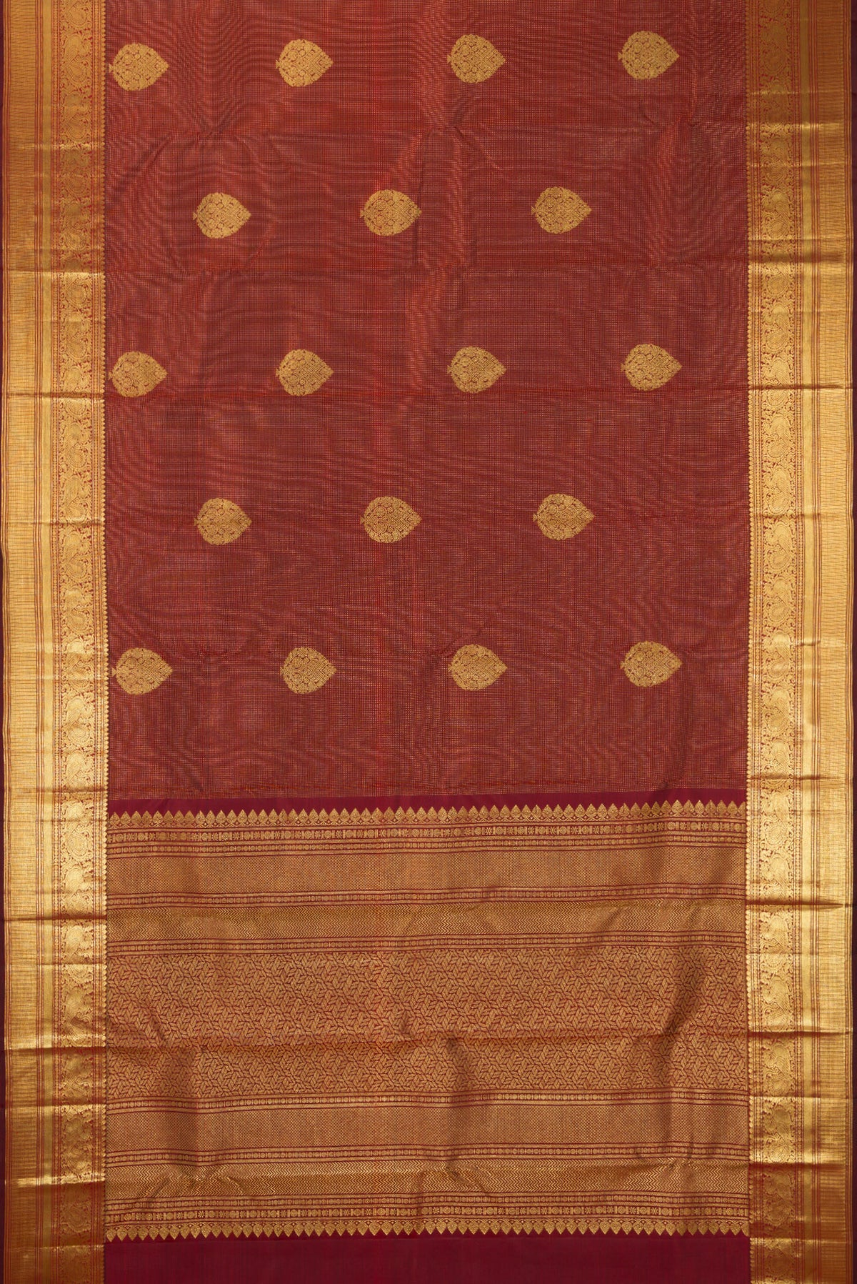 Flat view of Pure Silk Maroon Kanchipuram Saree with Zari Butta on the body and Zari Border. 