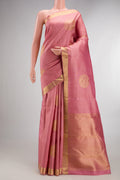 Pure Silk Coral Dual Tone Kanchipuram Saree with Zari Butta on the body and Zari Border.  displayed on a mannequin