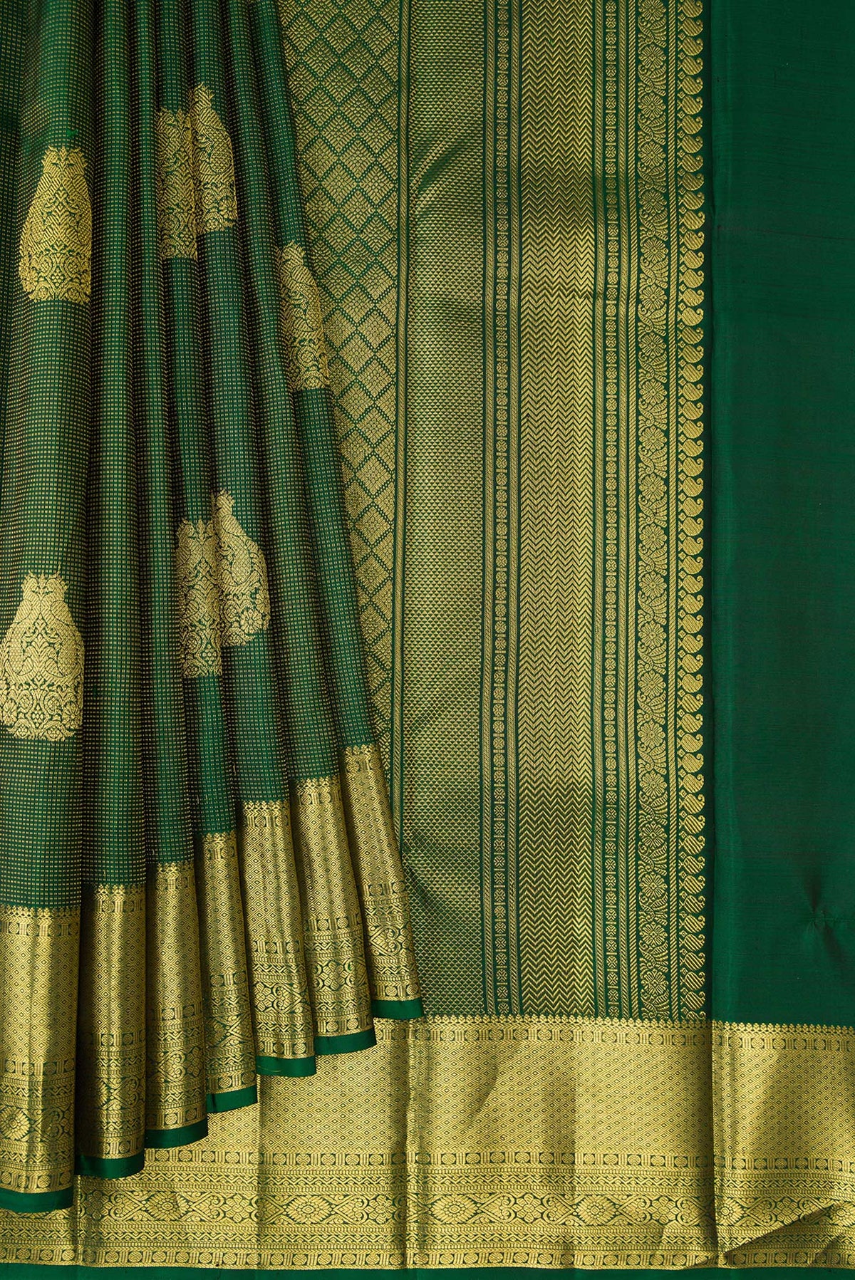 Pleats and pallu of Pure Silk Bottle Green Kanchipuram Saree with Zari Butta on the body and Zari Border. 