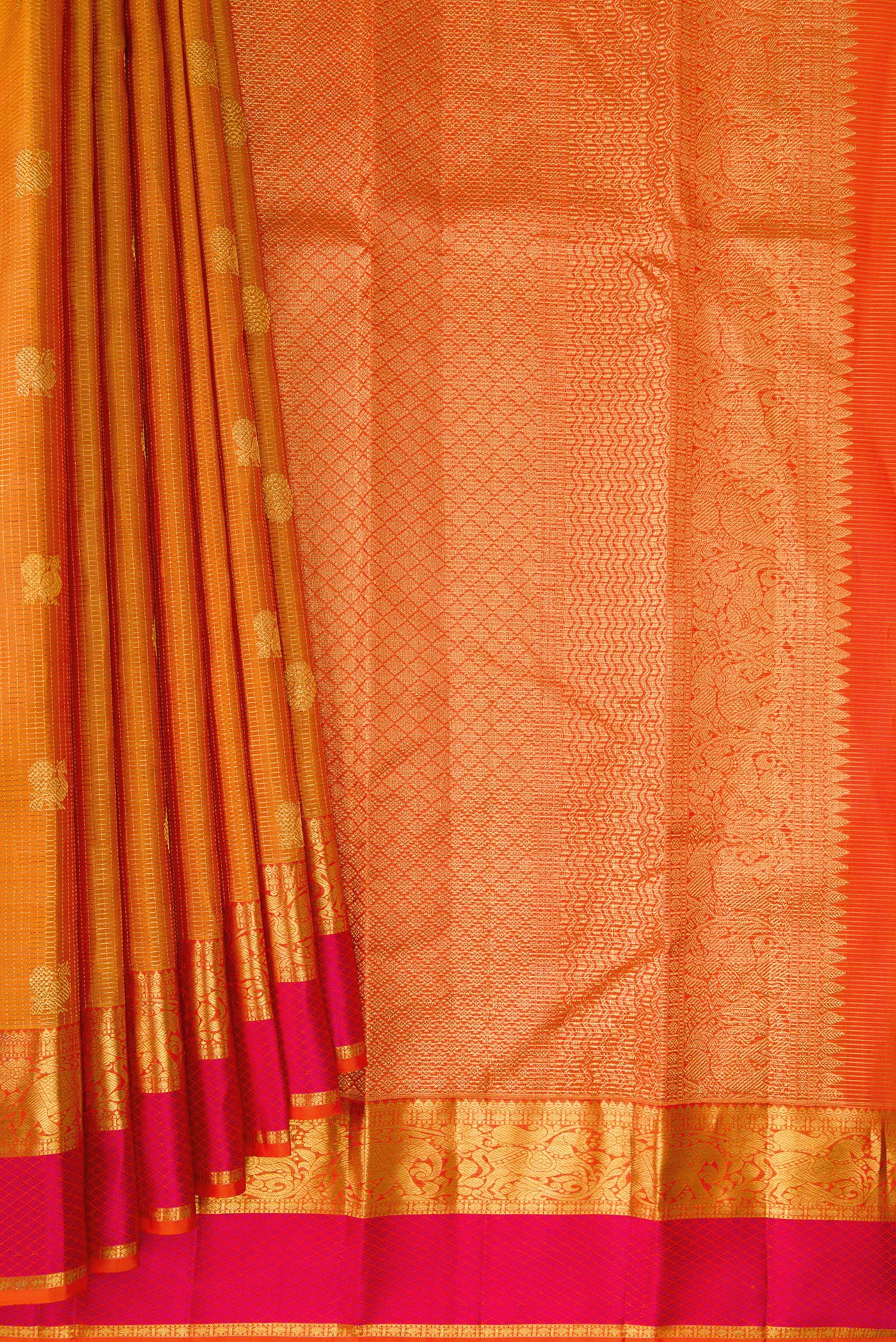 Pleats and pallu of Pure Silk Mustard Kanjivaram Saree with Checked design on the body and Zari And Thread Border. 