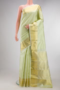 Pure Silk Pista Green Kanjivaram Saree with Jacquard design on the body and Zari Border.  displayed on a mannequin