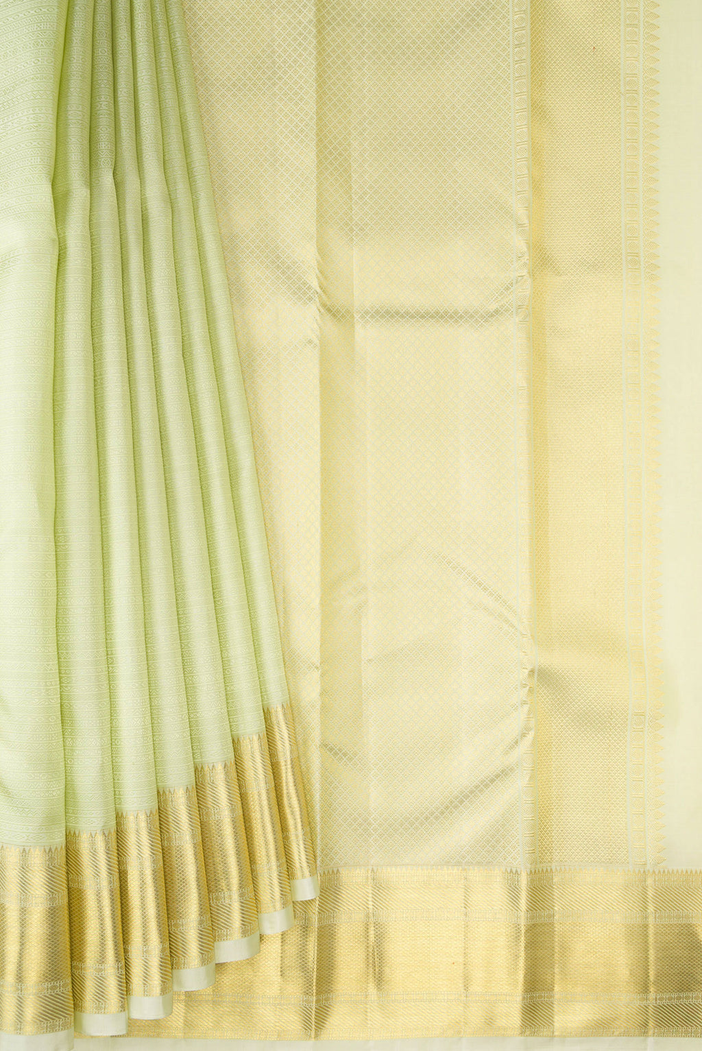Pleats and pallu of Pure Silk Pista Green Kanjivaram Saree with Jacquard design on the body and Zari Border. 