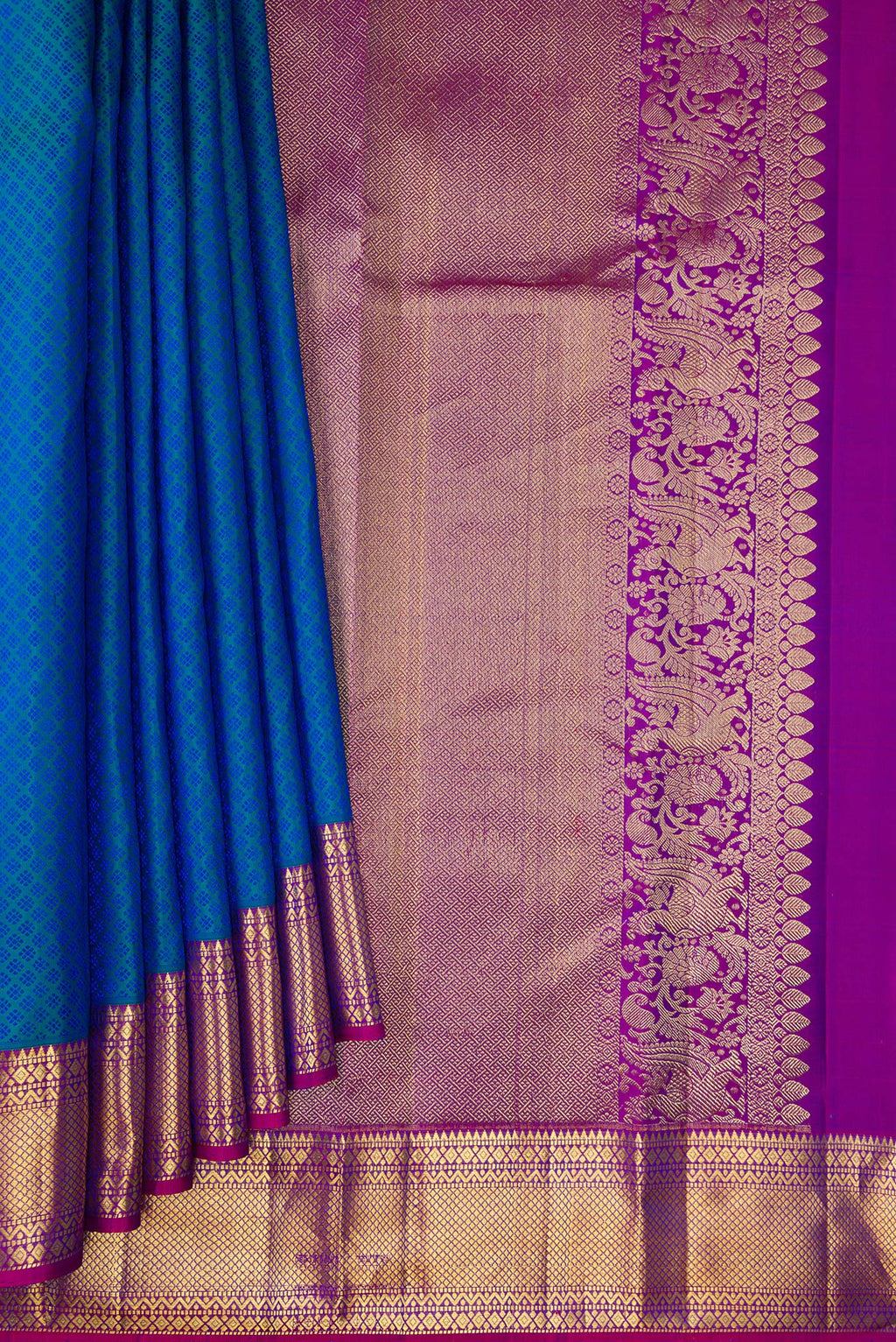 Pleats and pallu of Pure Silk Peacock Blue Dual Tone Kanjivaram Saree with Jacquard design on the body and Zari Border. 