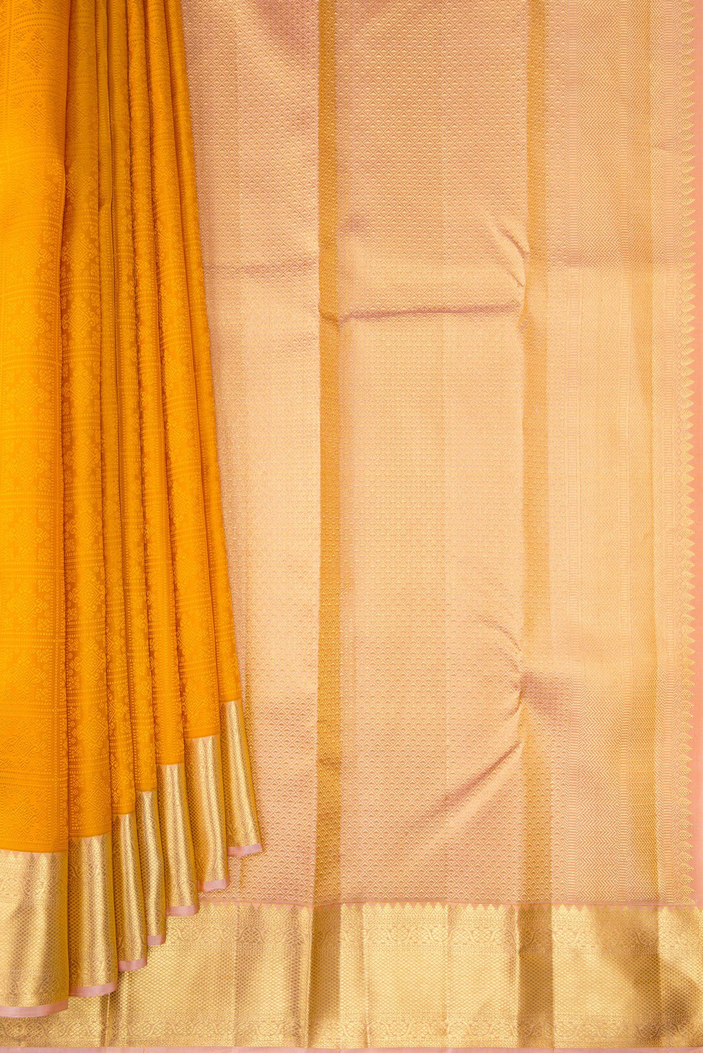 Pleats and pallu of Pure Silk Mustard Kanjivaram Saree with Jacquard design on the body and Zari Border. 
