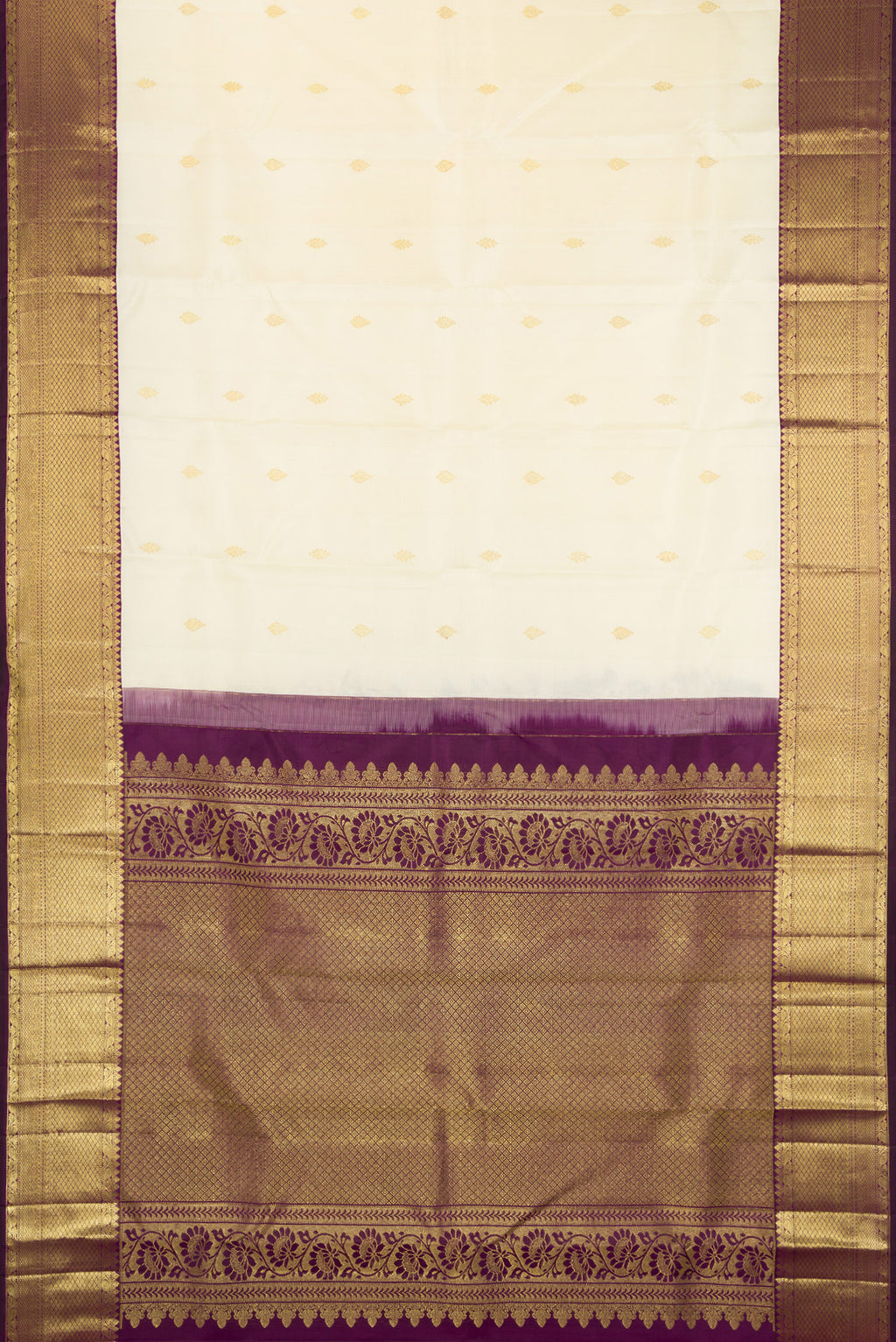 Flat view of Off White Kanjivaram Silk Saree with Zari Butta on the body and Zari Border. 