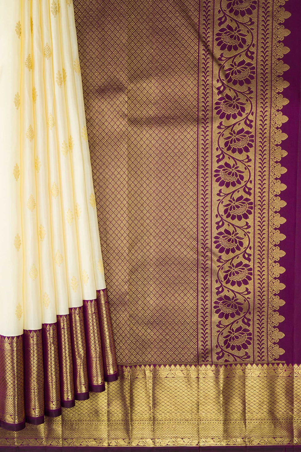 Pleats and pallu of Off White Kanjivaram Silk Saree with Zari Butta on the body and Zari Border. 