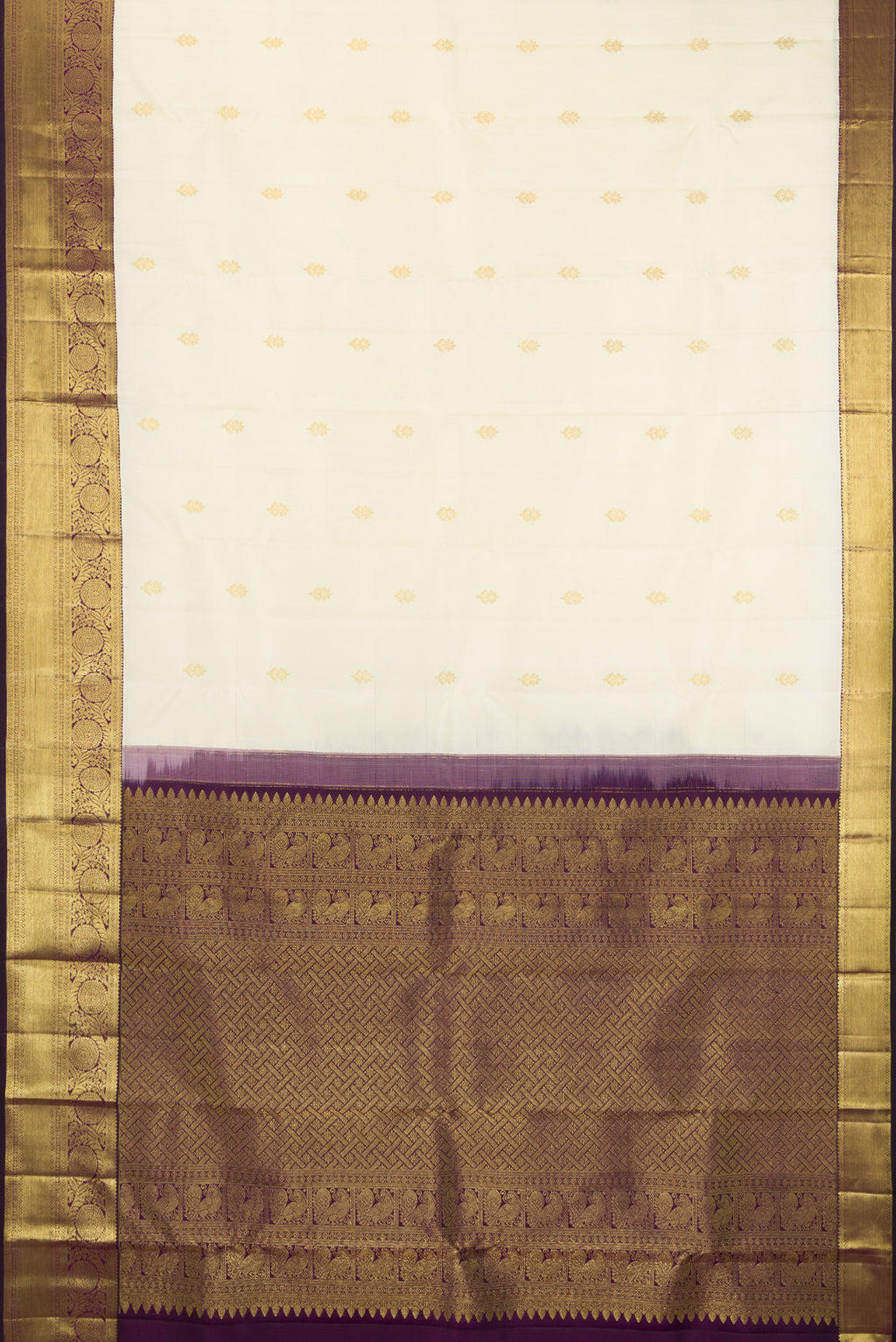 Flat view of Off White Kanjivaram Silk Saree with Zari Butta on the body and Zari Border. 