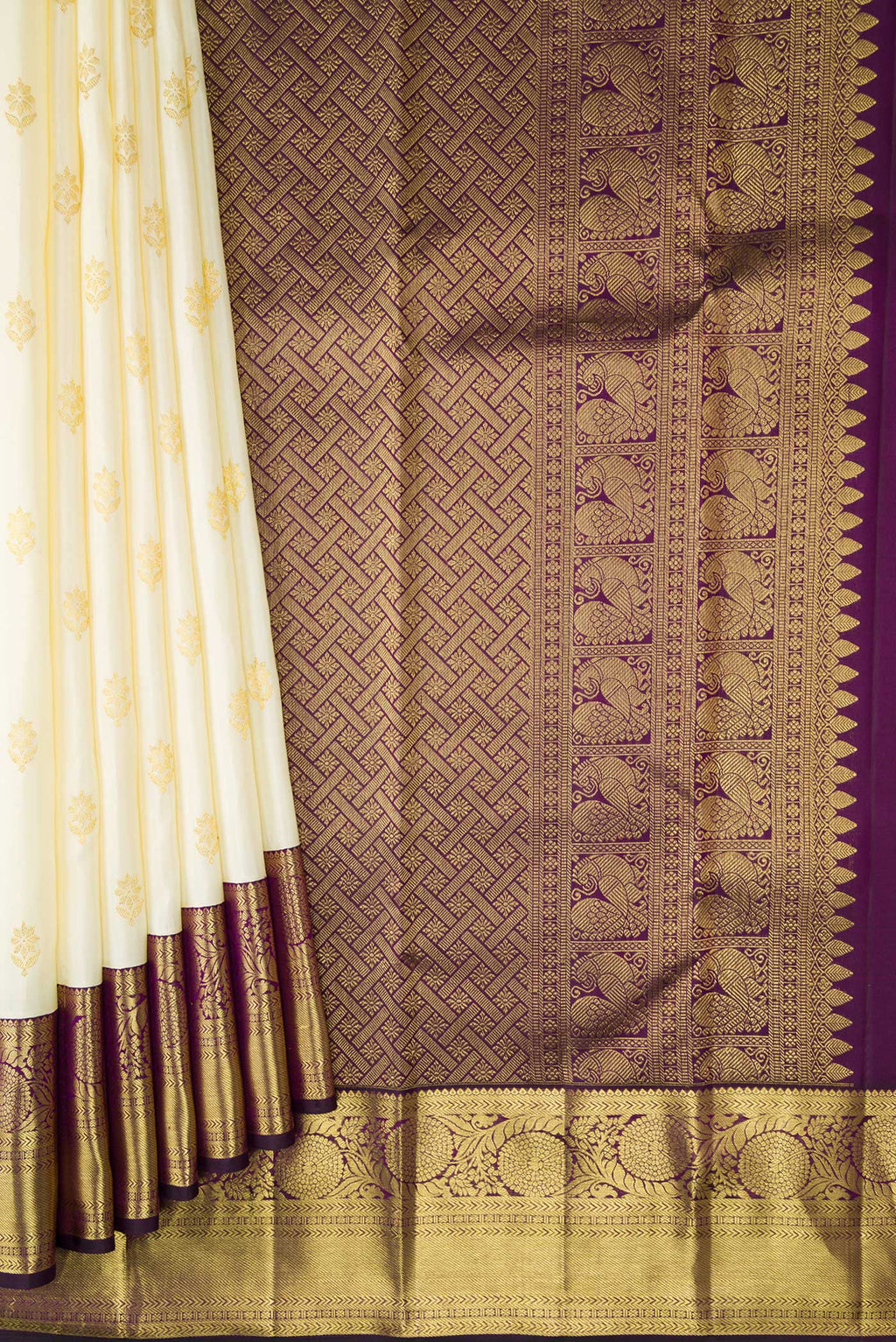 Pleats and pallu of Off White Kanjivaram Silk Saree with Zari Butta on the body and Zari Border. 