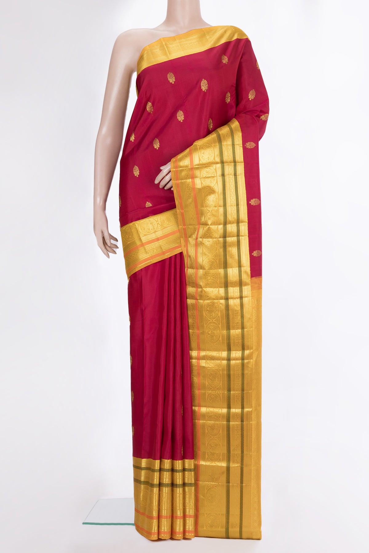 Pure Silk Red Kanjivaram Saree with Zari Butta on the body and Zari Border.  displayed on a mannequin
