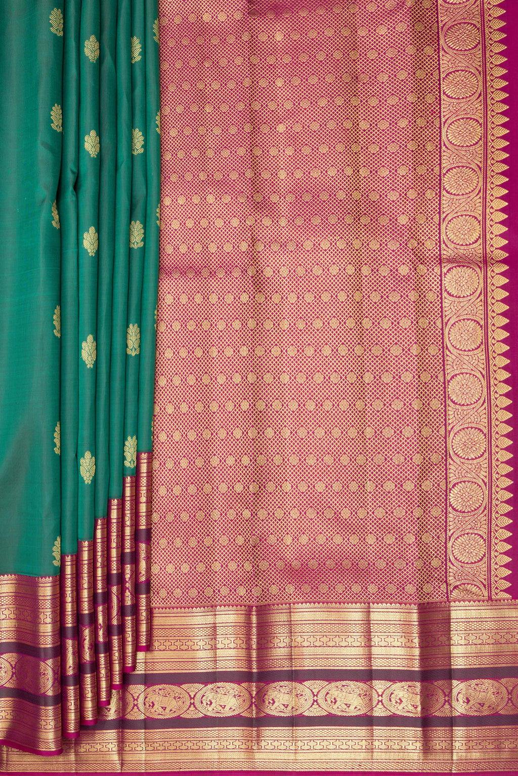 Pleats and pallu of Pure Silk Bottle Green Kanjivaram Saree with Zari Butta on the body and Zari Border. 