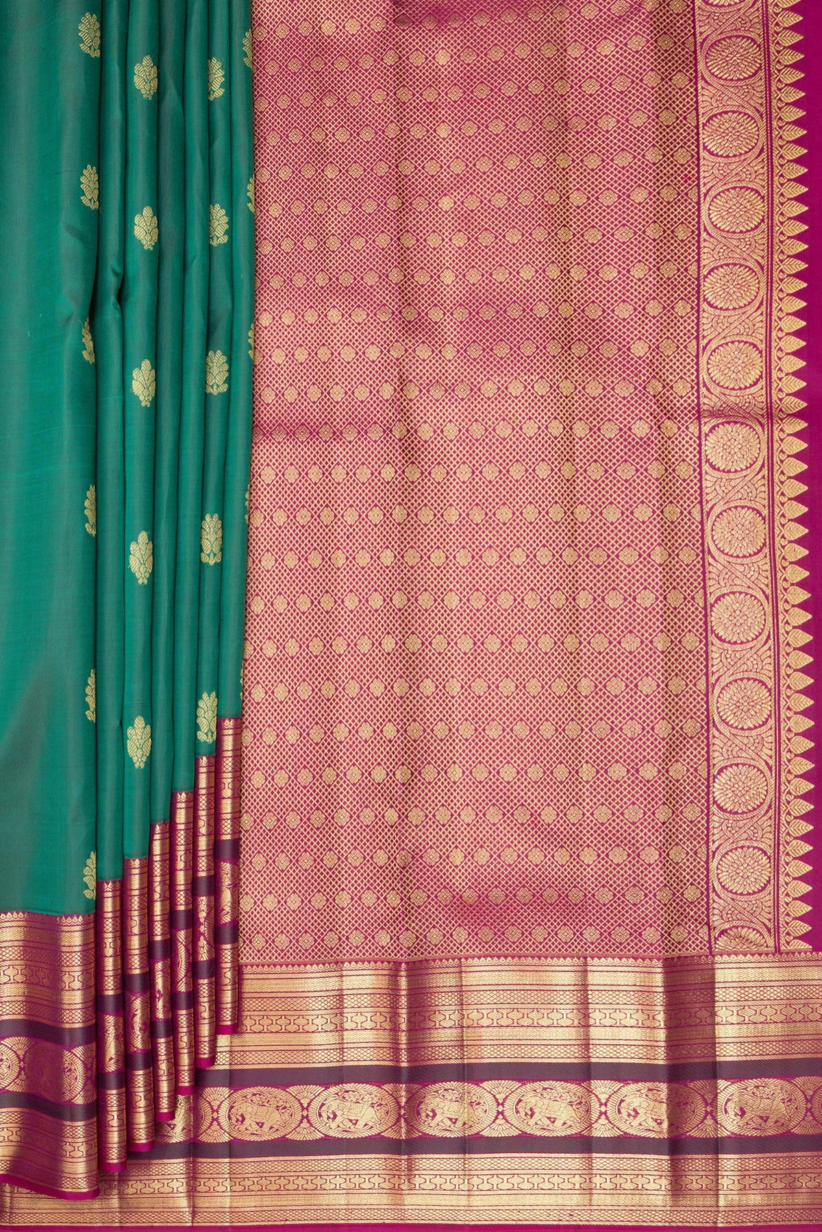 Pleats and pallu of Pure Silk Bottle Green Kanjivaram Saree with Zari Butta on the body and Zari Border. 