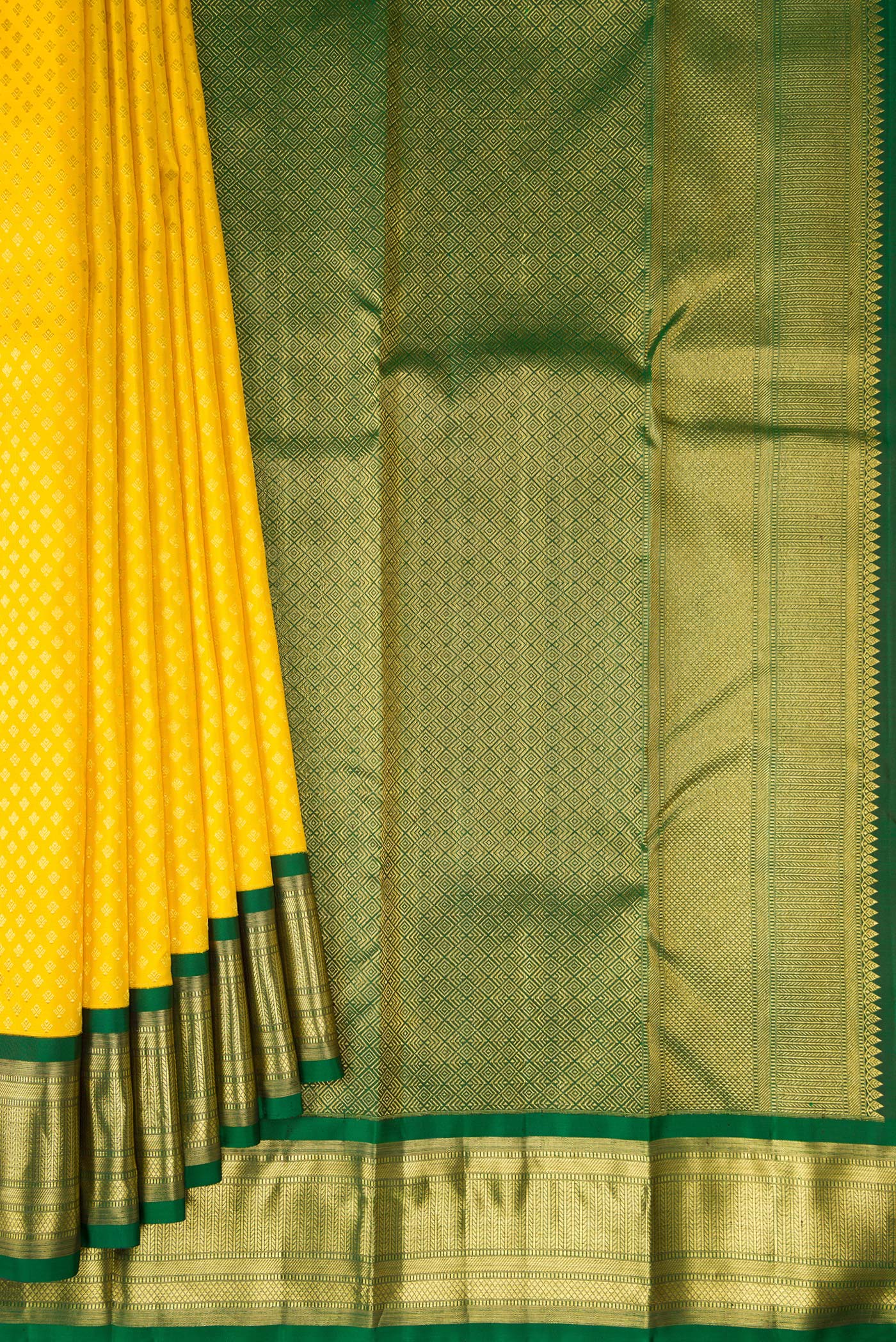 Pleats and pallu of Pure Silk Yellow Kanjivaram Saree with Zari Brocade on the body and Zari Border. 