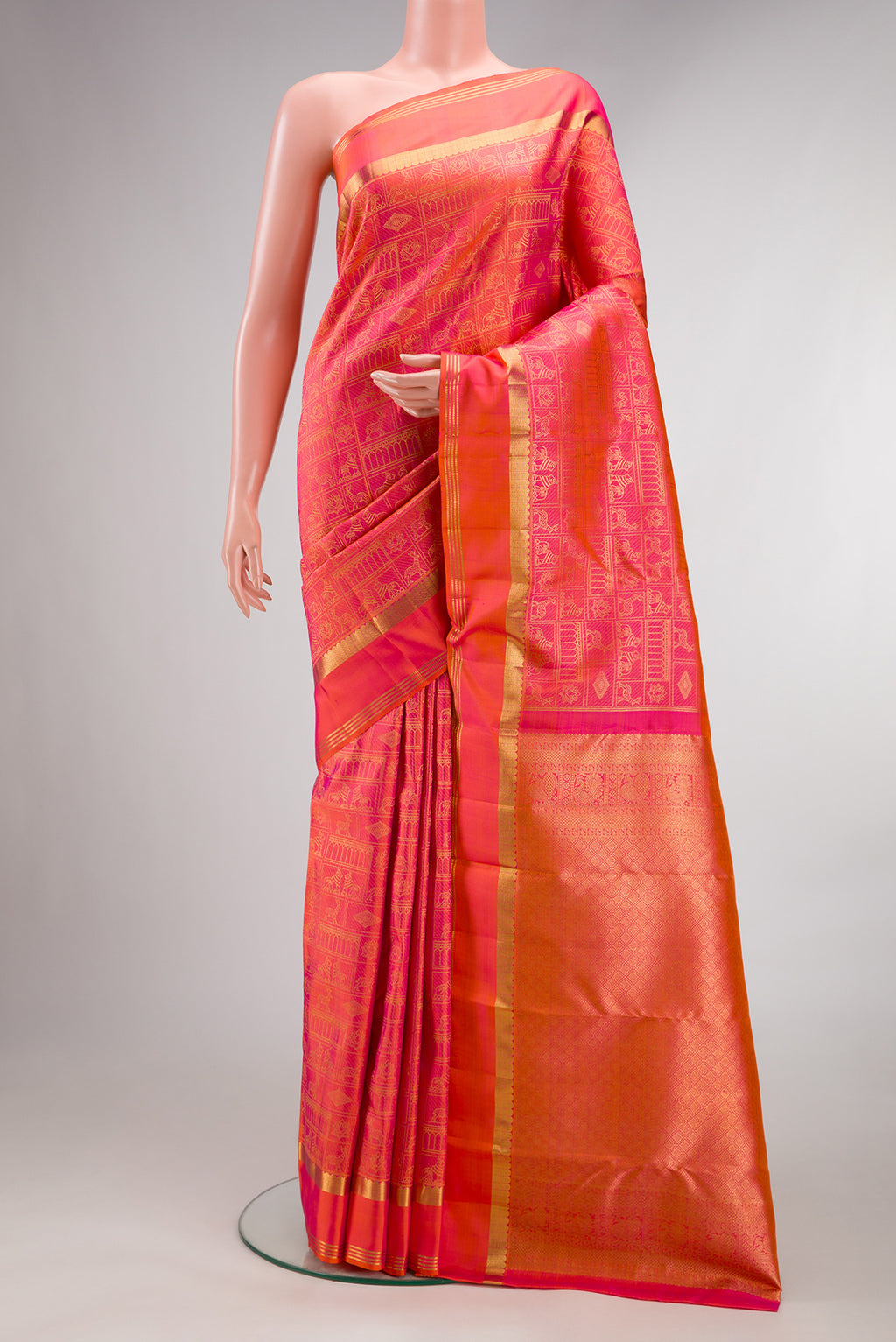 Pure Silk Pink with Orange Color Kanjivaram Saree with Zari Brocade on the body and Zari Border.  displayed on a mannequin