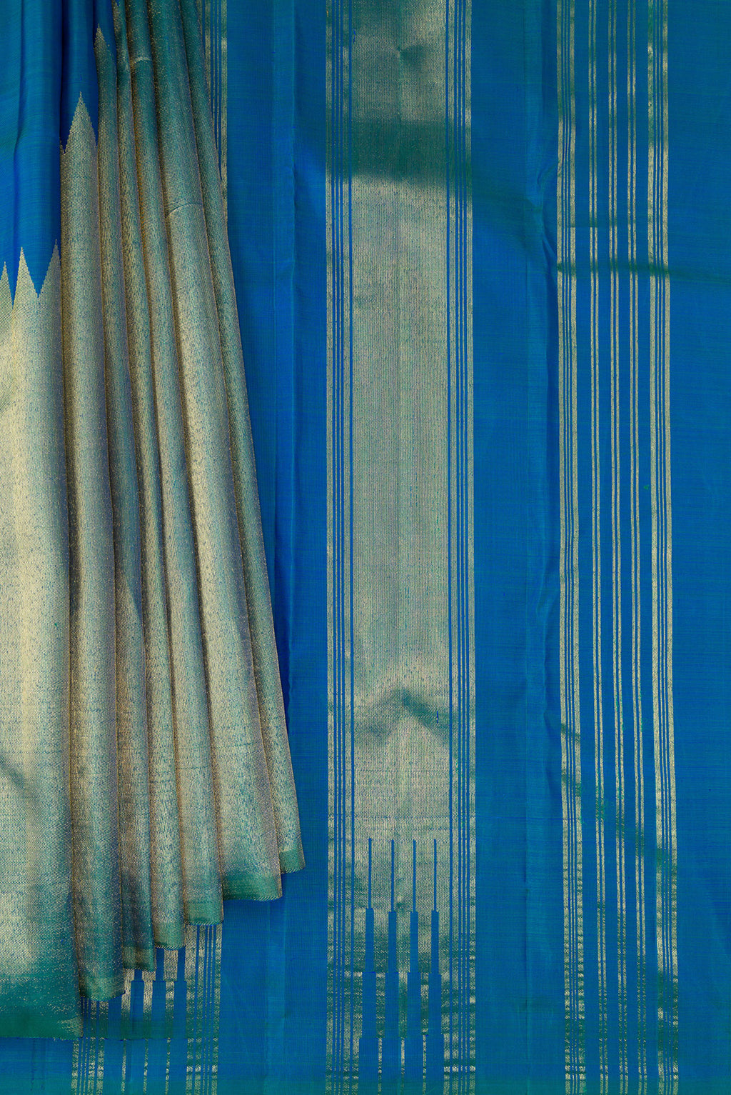 Pleats and pallu of Pure Silk Peacock Blue Dual Tone Kanjivaram Saree with Plain Body and Rising Temple Border. 
