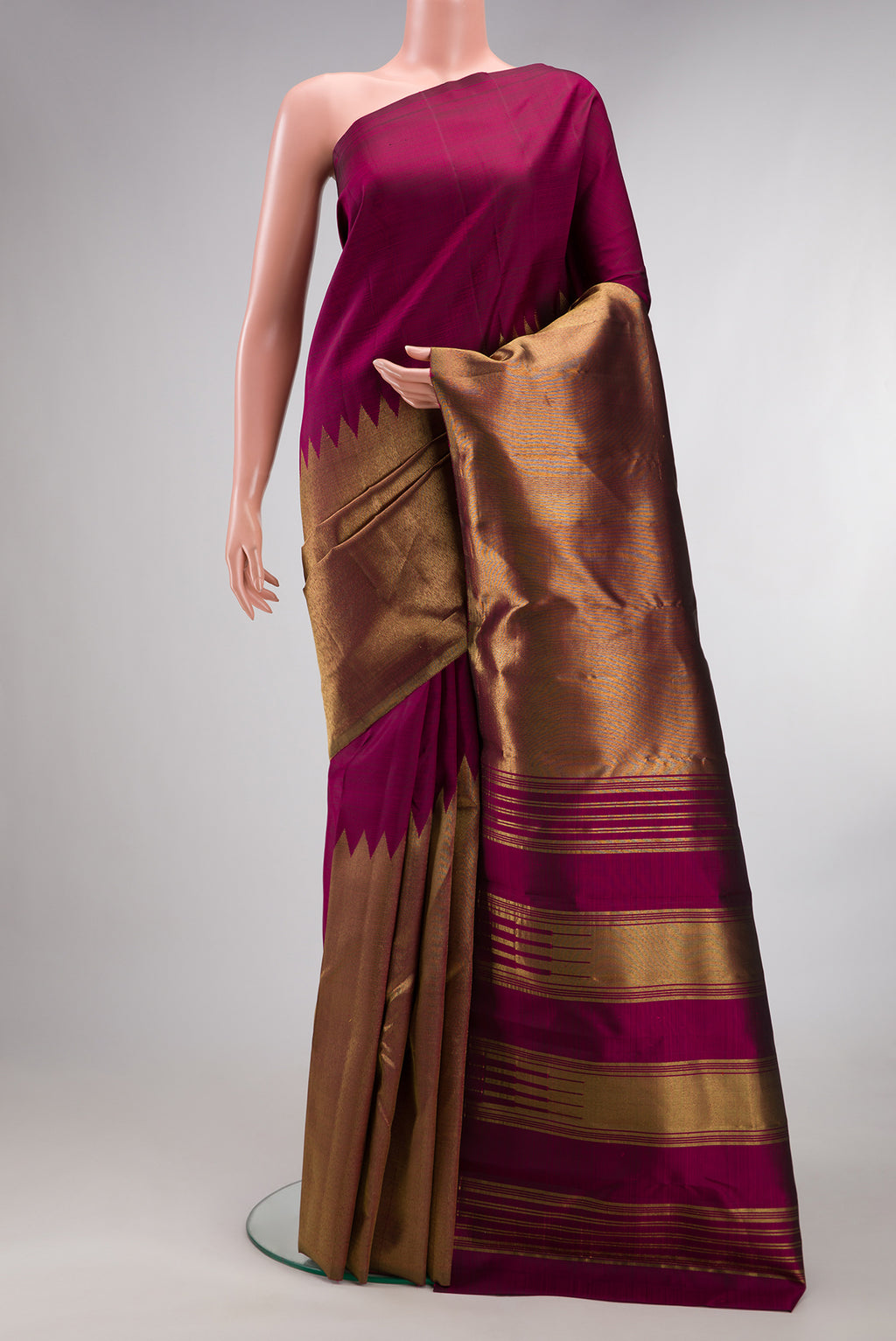 Pure Silk Maroon Kanjivaram Saree with Plain Body and Rising Temple Border.  displayed on a mannequin
