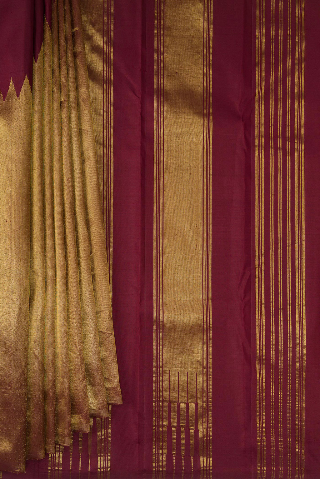 Pleats and pallu of Pure Silk Maroon Kanjivaram Saree with Plain Body and Rising Temple Border. 