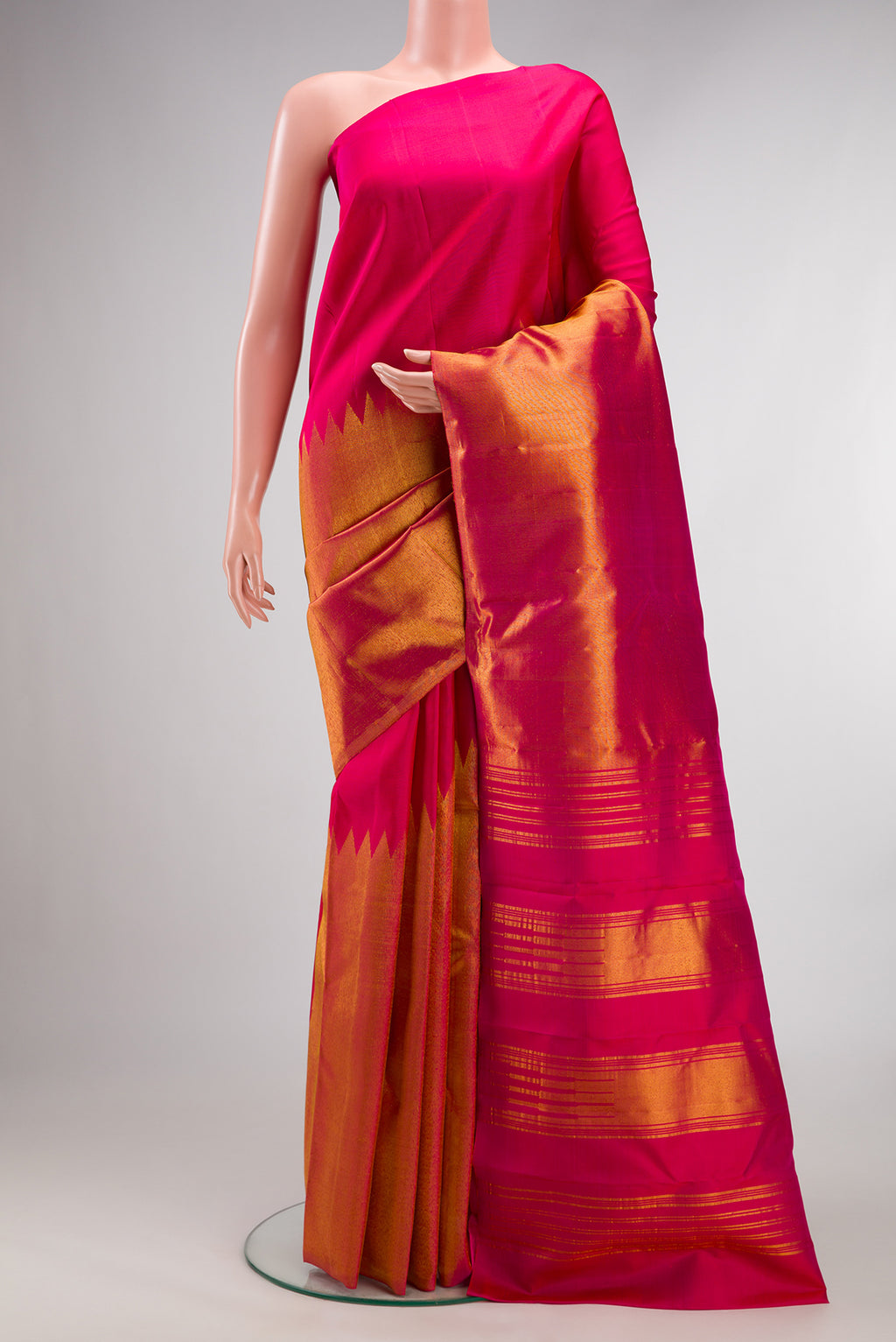 Pure Silk Dark Pink Dual Tone Kanjivaram Saree with Plain Body and Rising Temple Border.  displayed on a mannequin