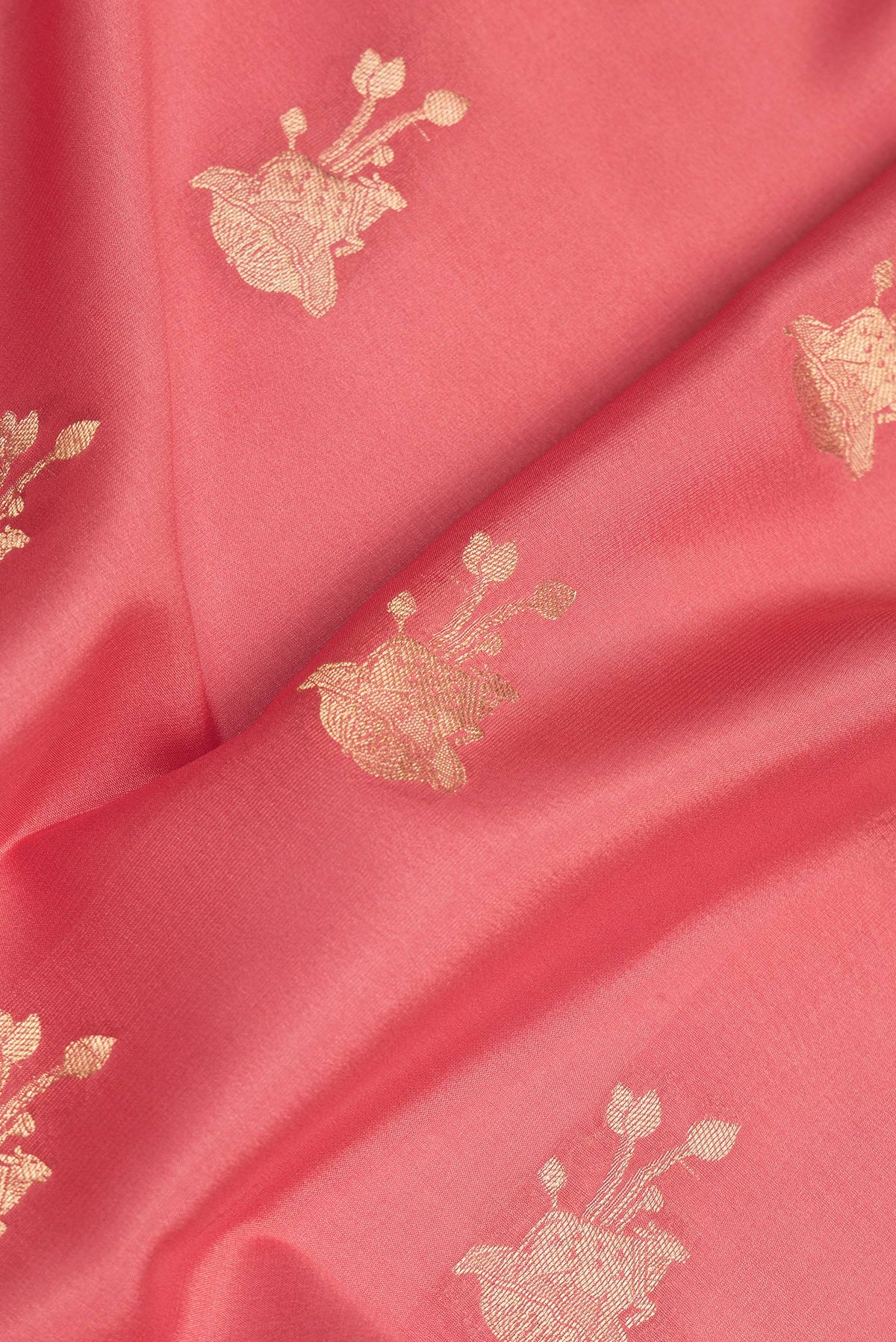 Close up of Pure Silk Pink Dual Tone Banarasi Georgette Saree with Zari Butta on the body and Zari Border.  displaying folds