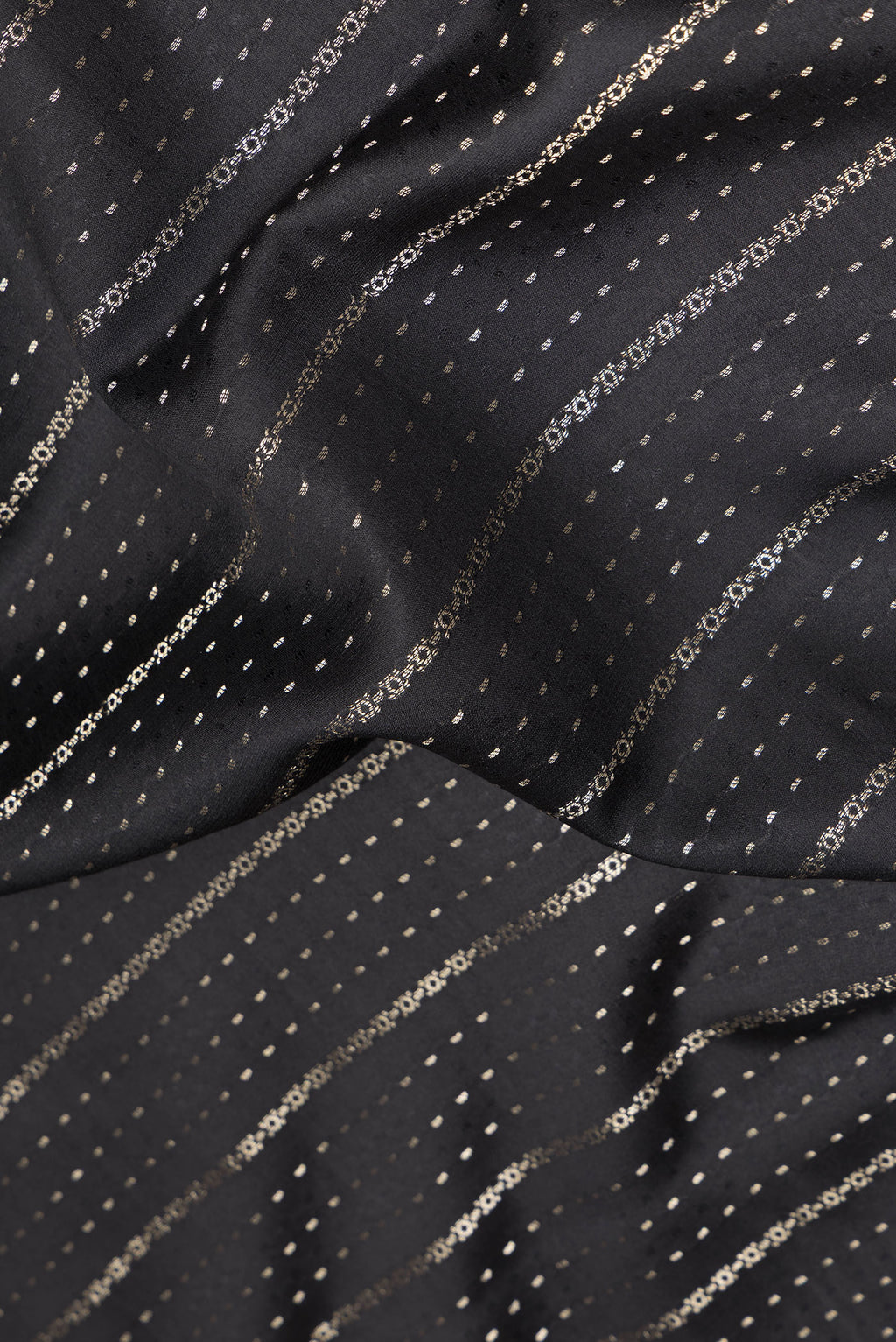 Close up of Pure Silk Black Dual Tone Banarasi Georgette Saree with Stripes on the body and Zari Border.  displaying folds