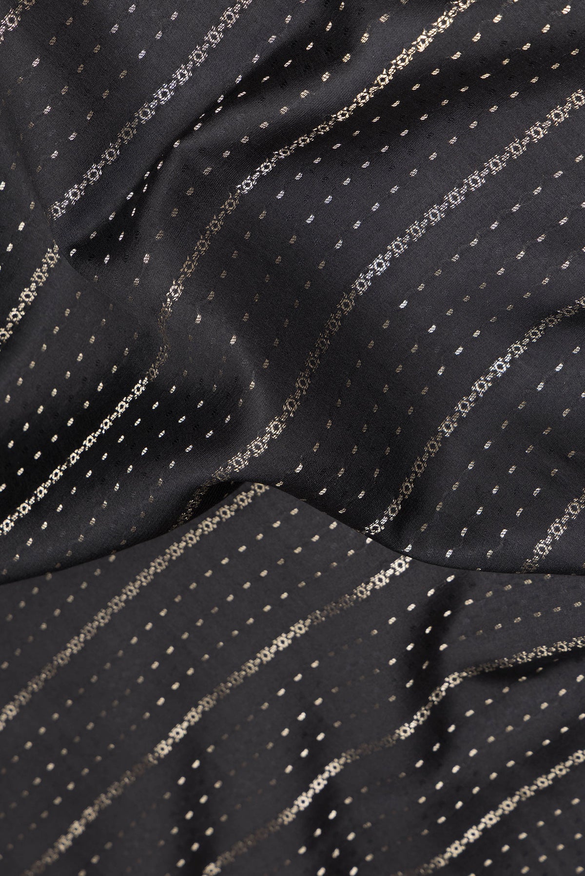 Close up of Pure Silk Black Dual Tone Banarasi Georgette Saree with Stripes on the body and Zari Border.  displaying folds
