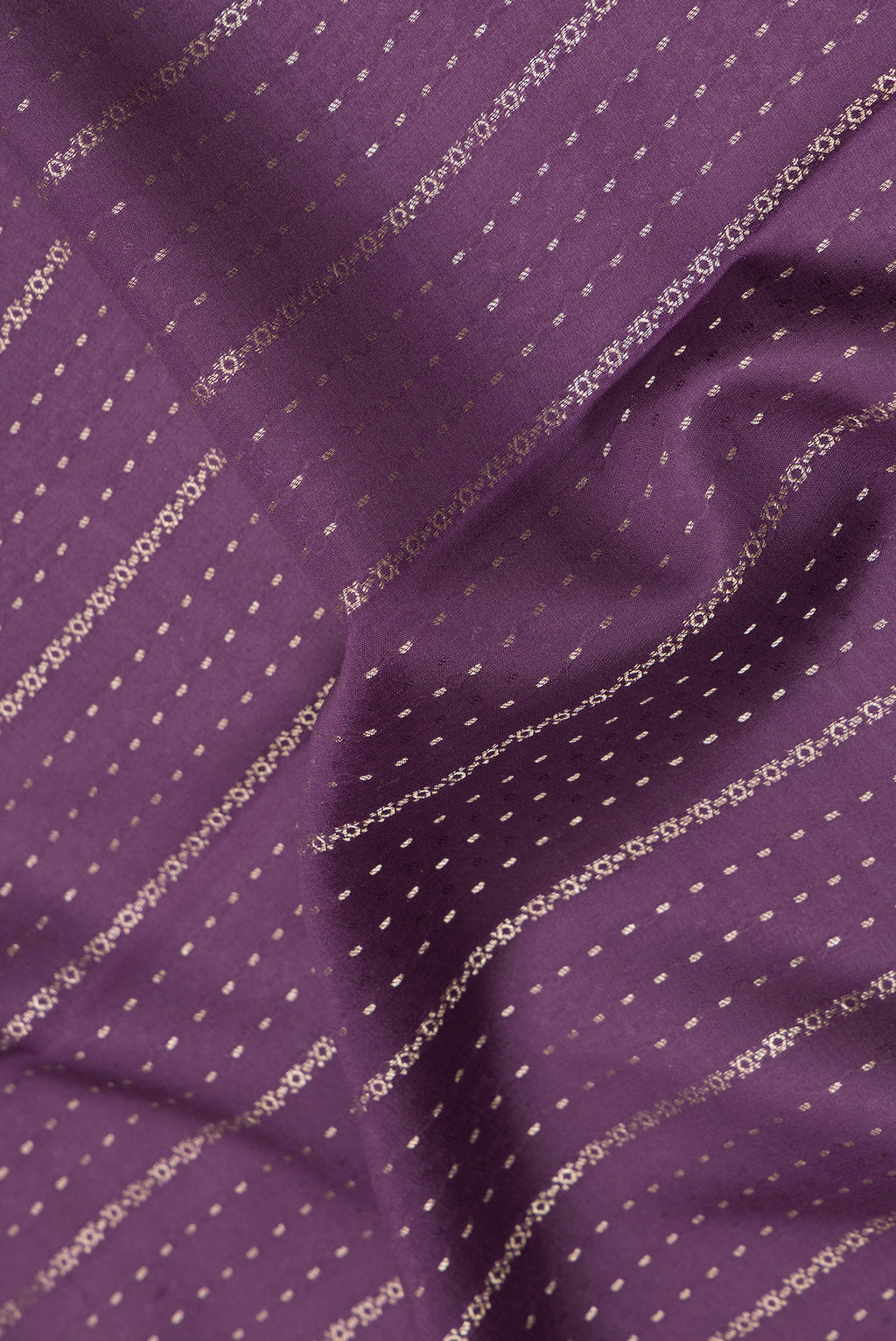 Close up of Purple Dual Tone Banarasi Georgette Saree with Stripes on the body and Zari Border.  displaying folds