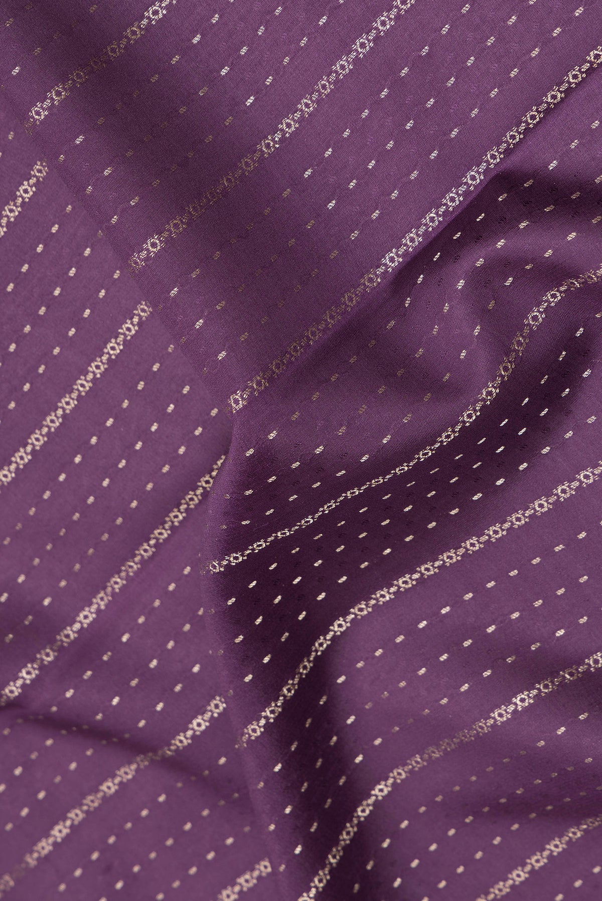 Close up of Purple Dual Tone Banarasi Georgette Saree with Stripes on the body and Zari Border.  displaying folds