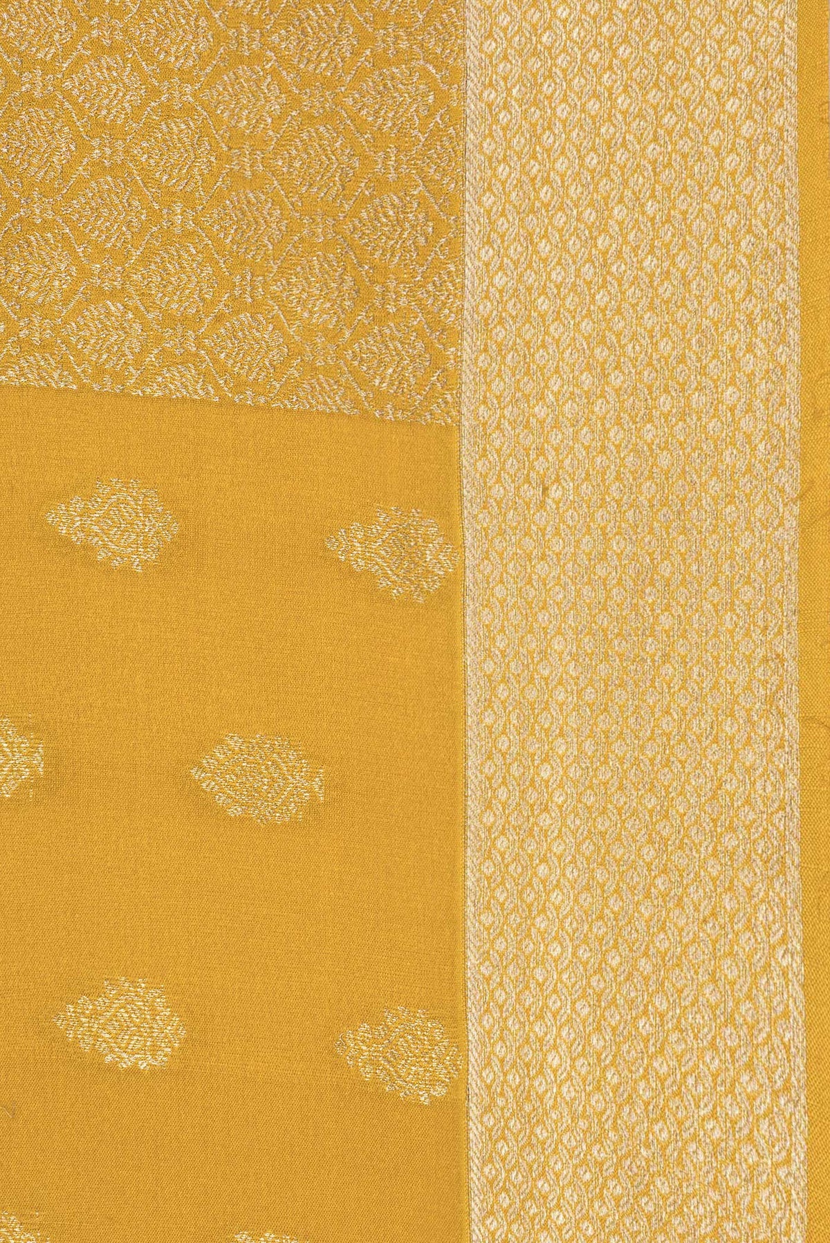 Border image of Pure Silk Mustard Dual Tone Banarasi Georgette Saree with Zari Butta on the body and Zari Border. 