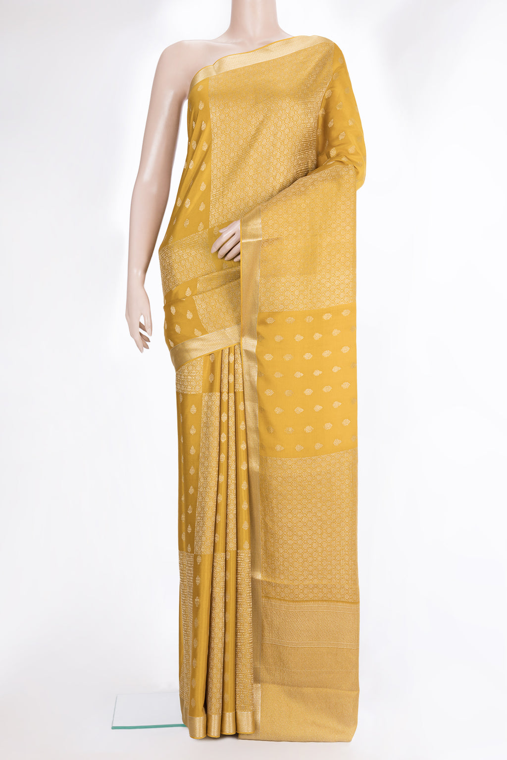 Pure Silk Mustard Dual Tone Banarasi Georgette Saree with Zari Butta on the body and Zari Border.  displayed on a mannequin
