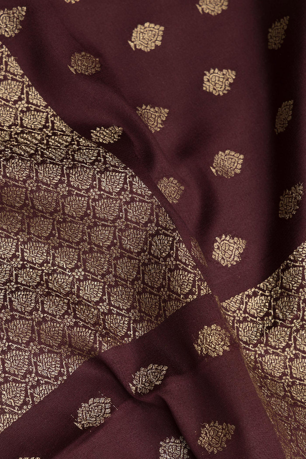 Close up of Pure Silk Coffee Brown Dual Tone Banarasi Georgette Saree with Zari Butta on the body and Zari Border.  displaying folds