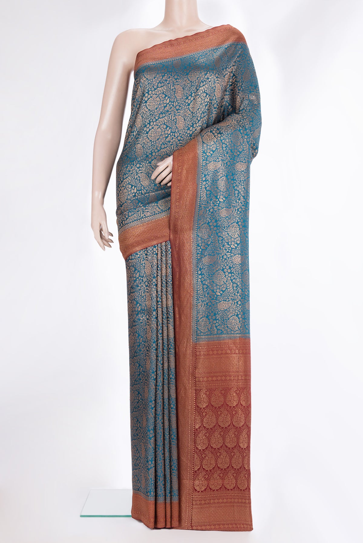 Peacock Blue Dual Tone Banarasi Georgette Saree with Zari Brocade on the body and Zari Border.  displayed on a mannequin
