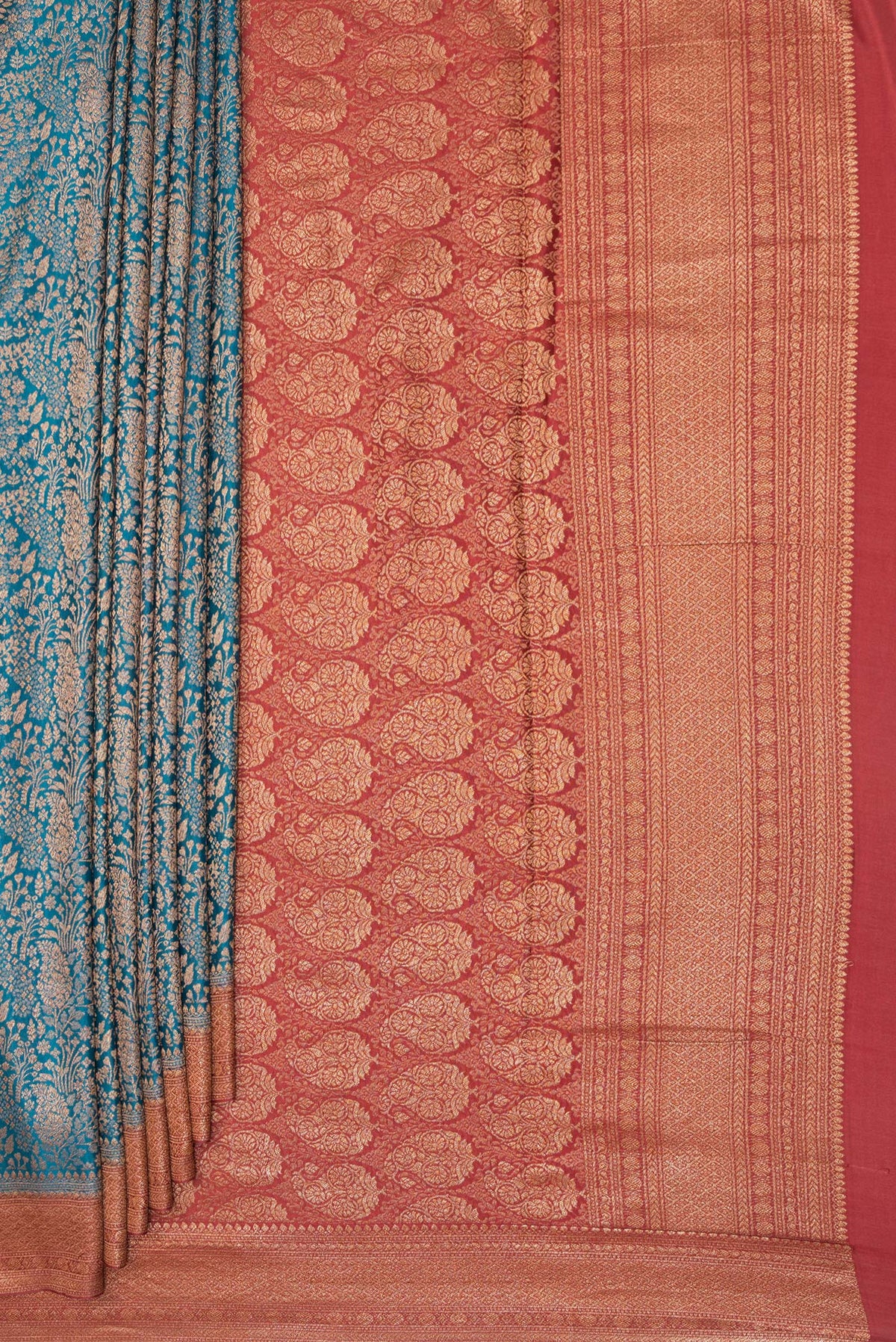 Pleats and pallu of Peacock Blue Dual Tone Banarasi Georgette Saree with Zari Brocade on the body and Zari Border. 