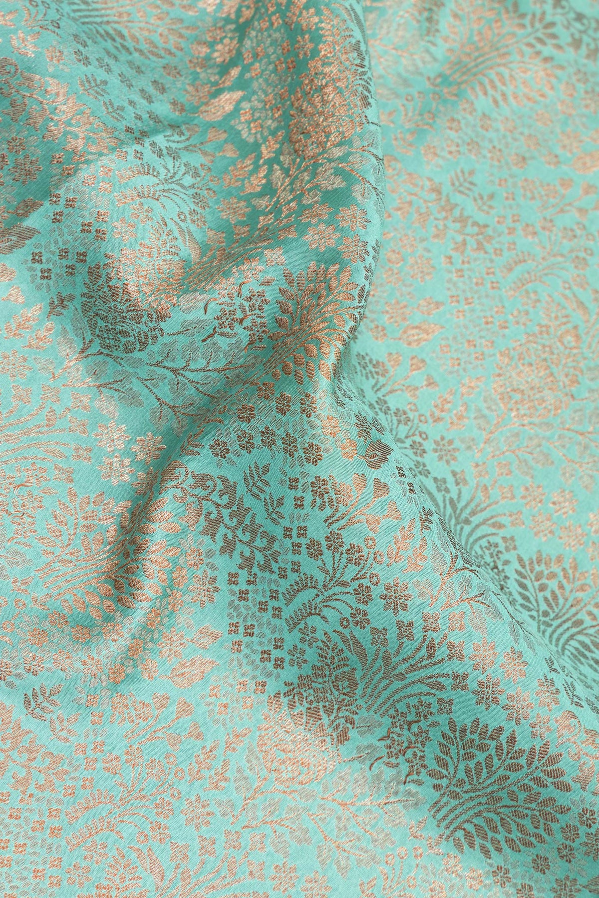 Close up of Sea Green Dual Tone Banarasi Georgette Saree with Zari Brocade on the body and Zari Border.  displaying folds