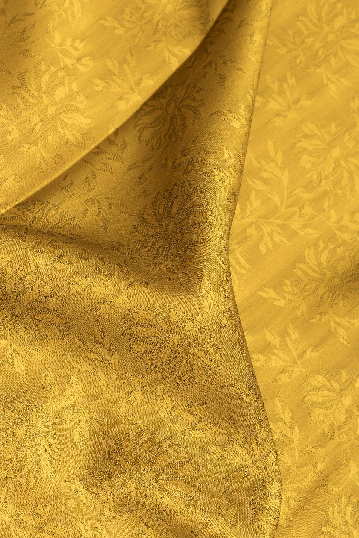 Close up of Mehandi Green Dual Tone Banarasi Georgette Saree with Jacquard design on the body and Zari Border.  displaying folds