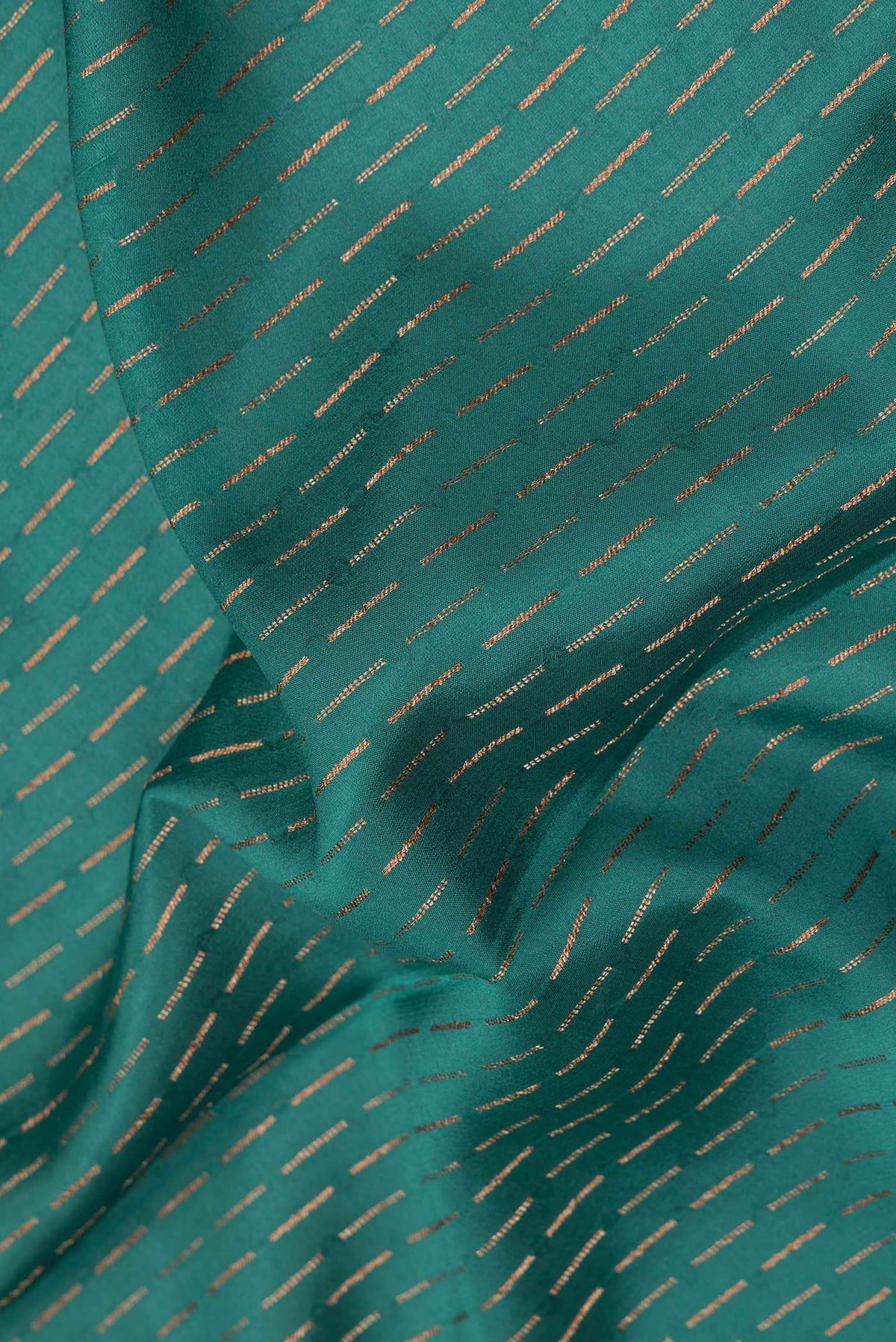 Close up of Bottle Green Dual Tone Banarasi Georgette Saree with Zari Brocade on the body and Fancy Border.  displaying folds