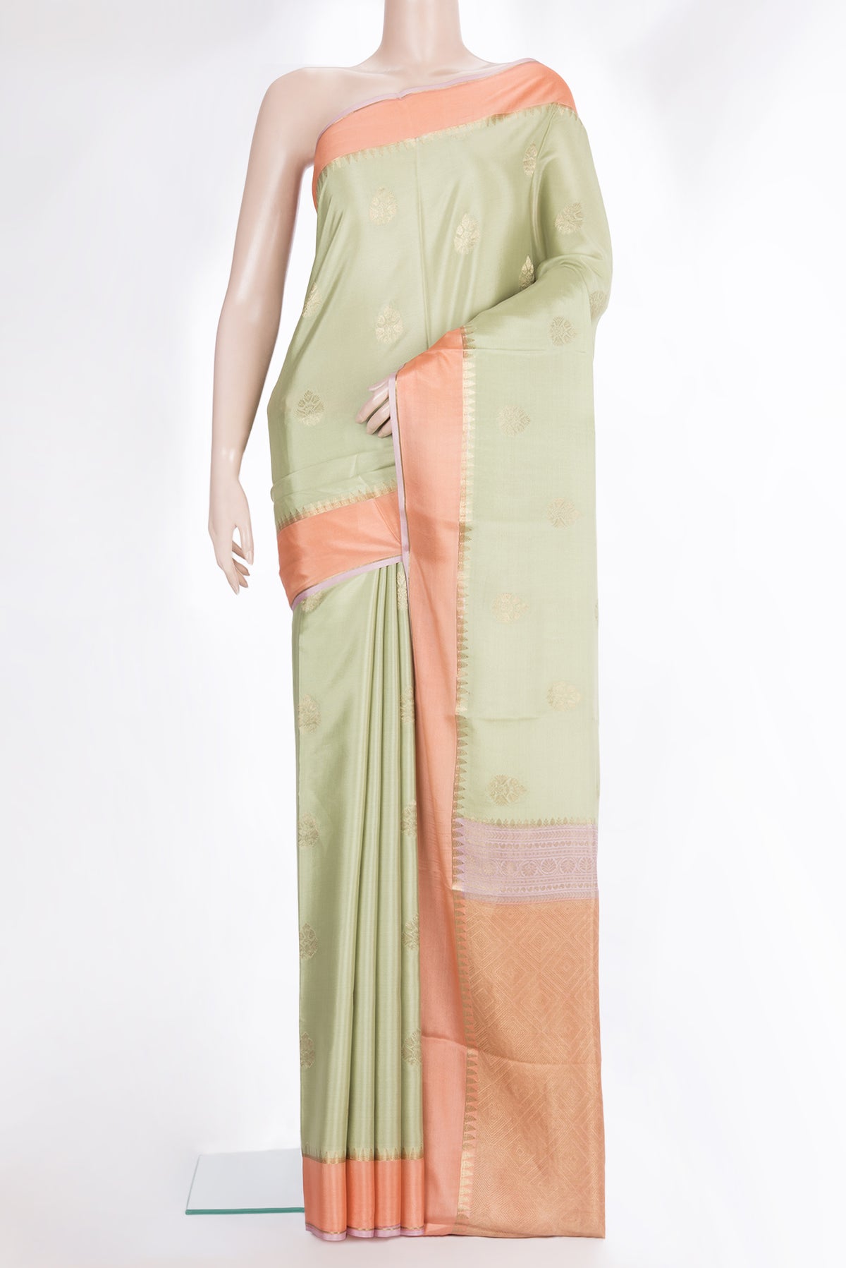 Pure Silk Pista Green Dual Tone Banarasi Georgette Saree with Zari Butta on the body and Zari Border.  displayed on a mannequin