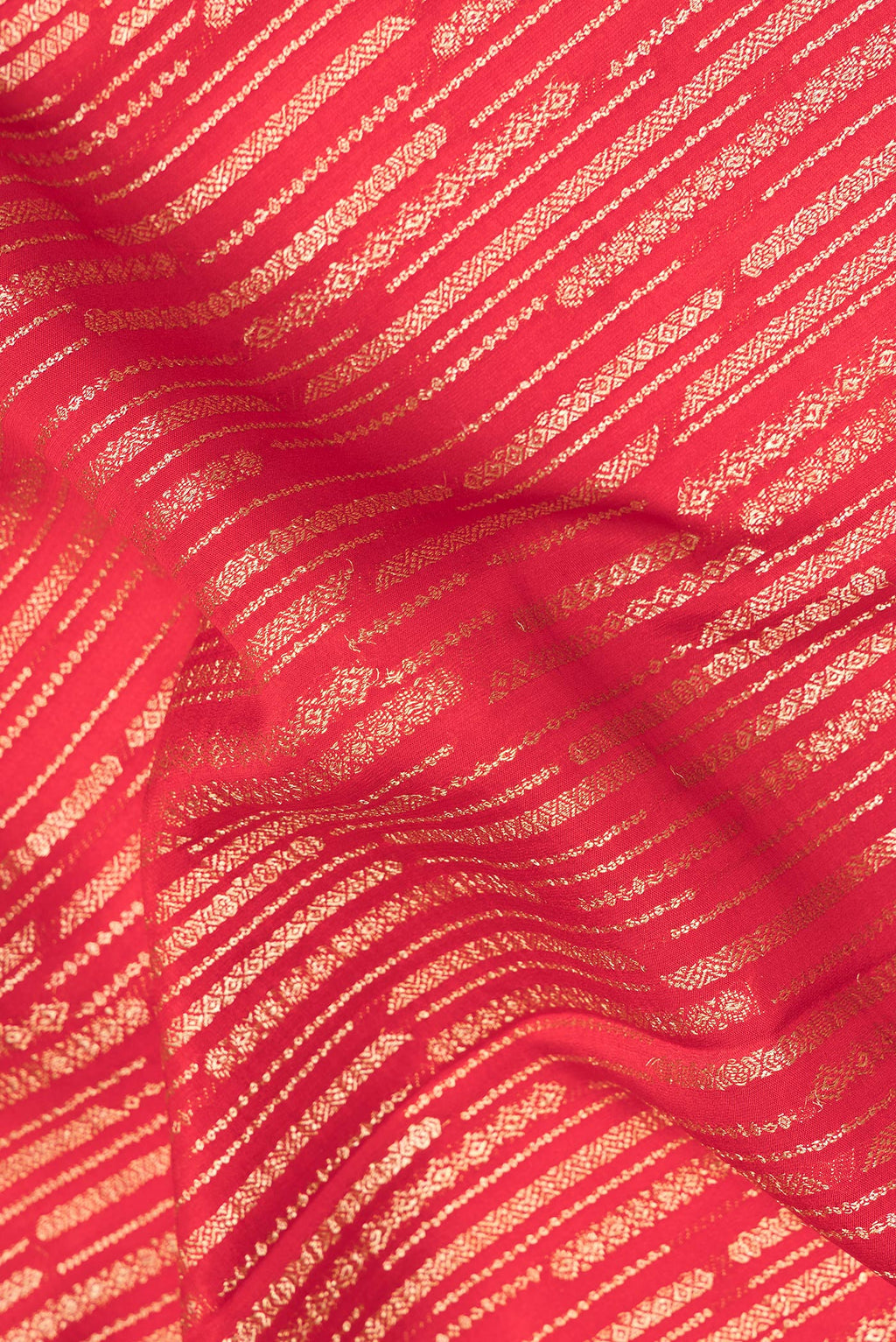 Close up of Red Dual Tone Banarasi Georgette Saree with Zari Brocade on the body and Zari Border.  displaying folds