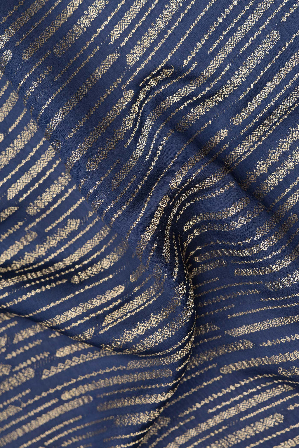Close up of Pure Silk Navy Blue Dual Tone Banarasi Georgette Saree with Zari Brocade on the body and Zari Border.  displaying folds