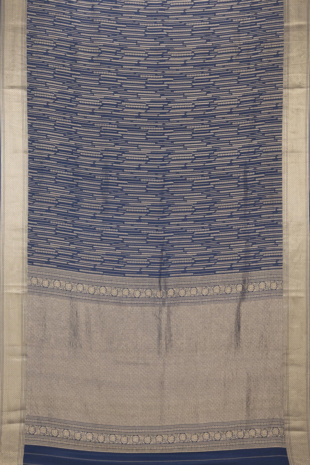 Flat view of Pure Silk Navy Blue Dual Tone Banarasi Georgette Saree with Zari Brocade on the body and Zari Border. 