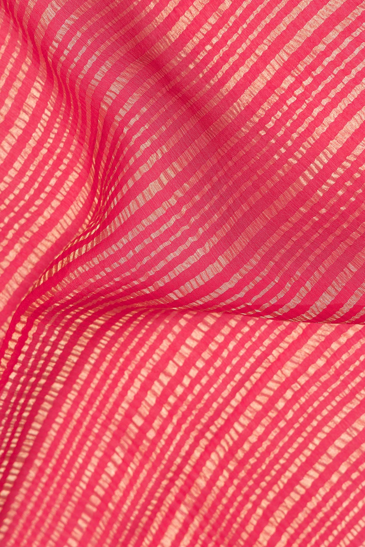 Close up of Red Mysore Crepe Saree with Stripes on the body and Zari Border.  displaying folds