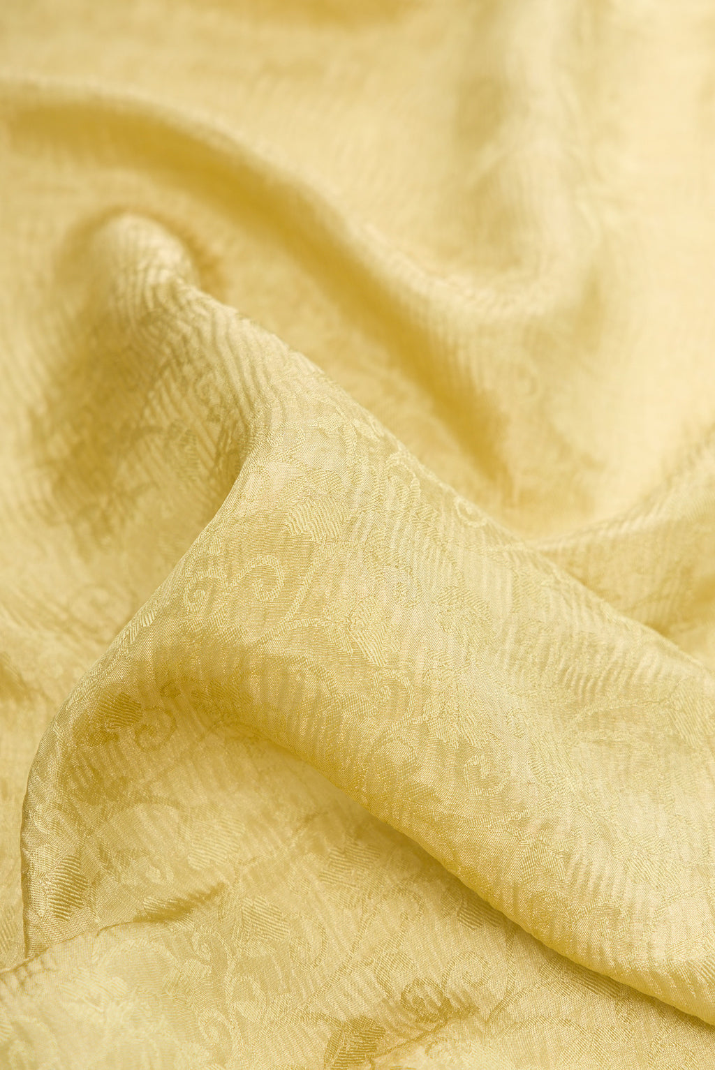 Close up of Sandal Mysore Chiffon Saree with Zari Brocade on the body and Zari Border.  displaying folds