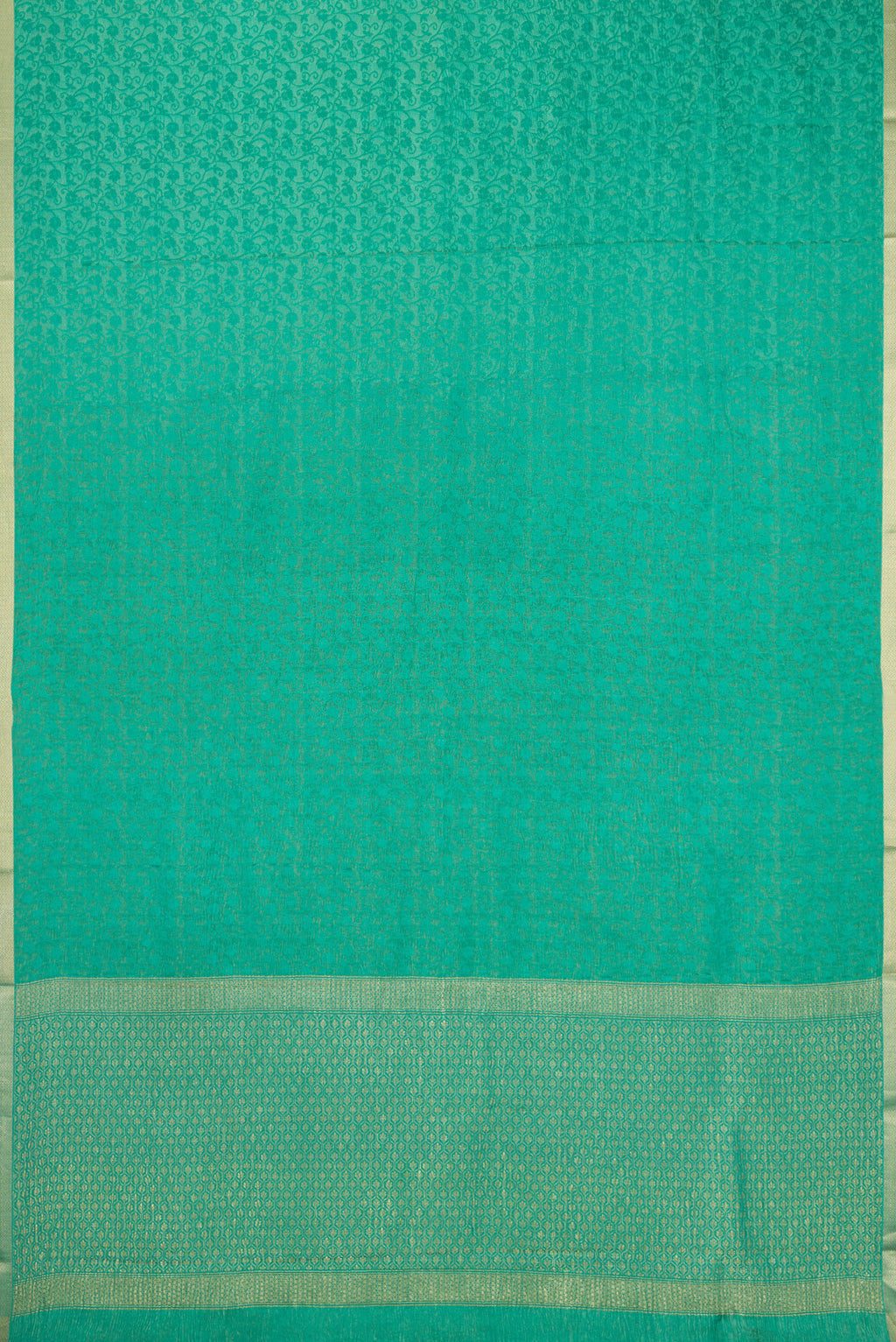 Flat view of Sea Green Mysore Crepe Saree with Zari Brocade on the body and Zari Border. 